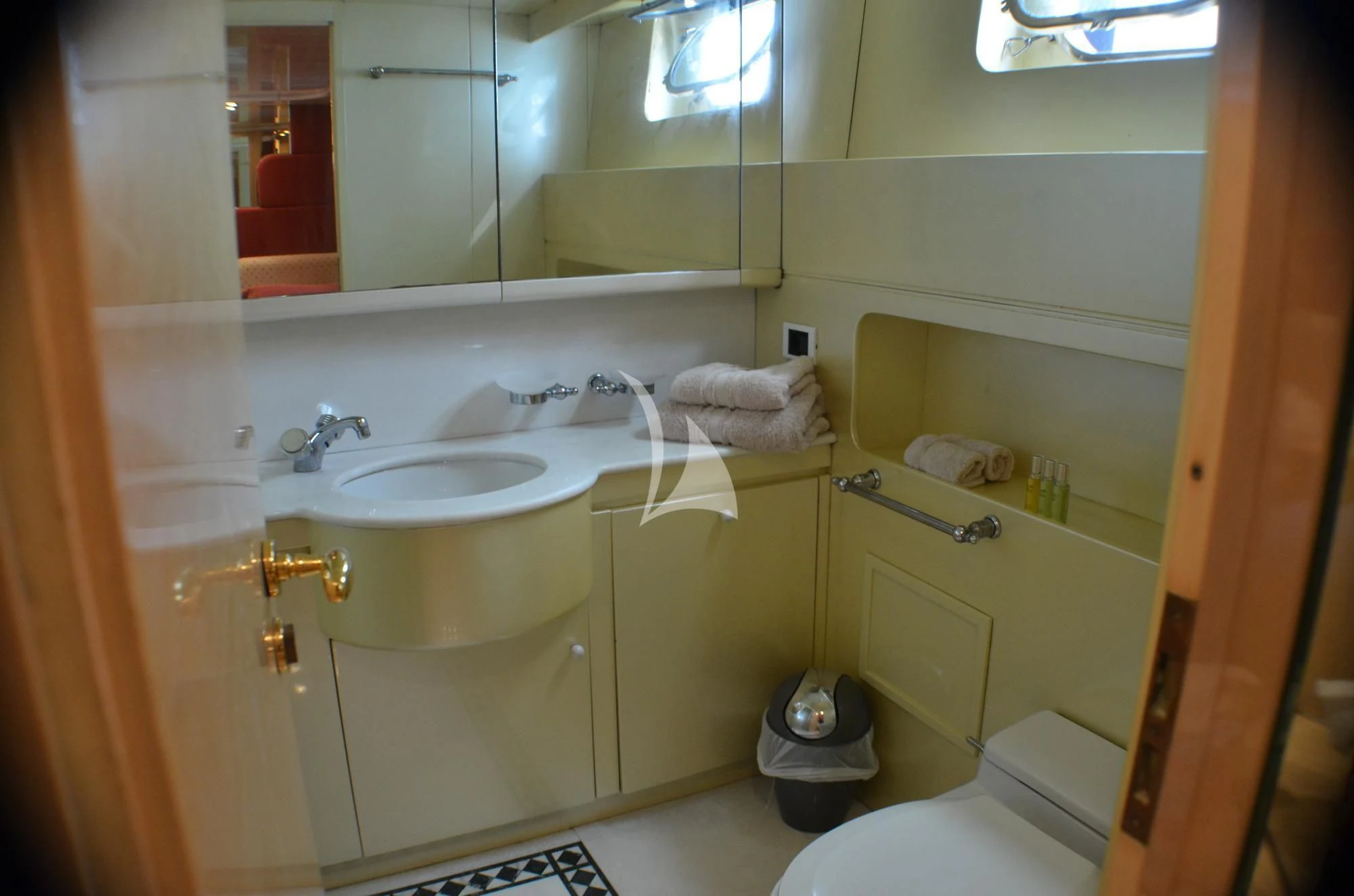a bathroom with a sink and a mirror aboard MISS CANDY Yacht for Charter