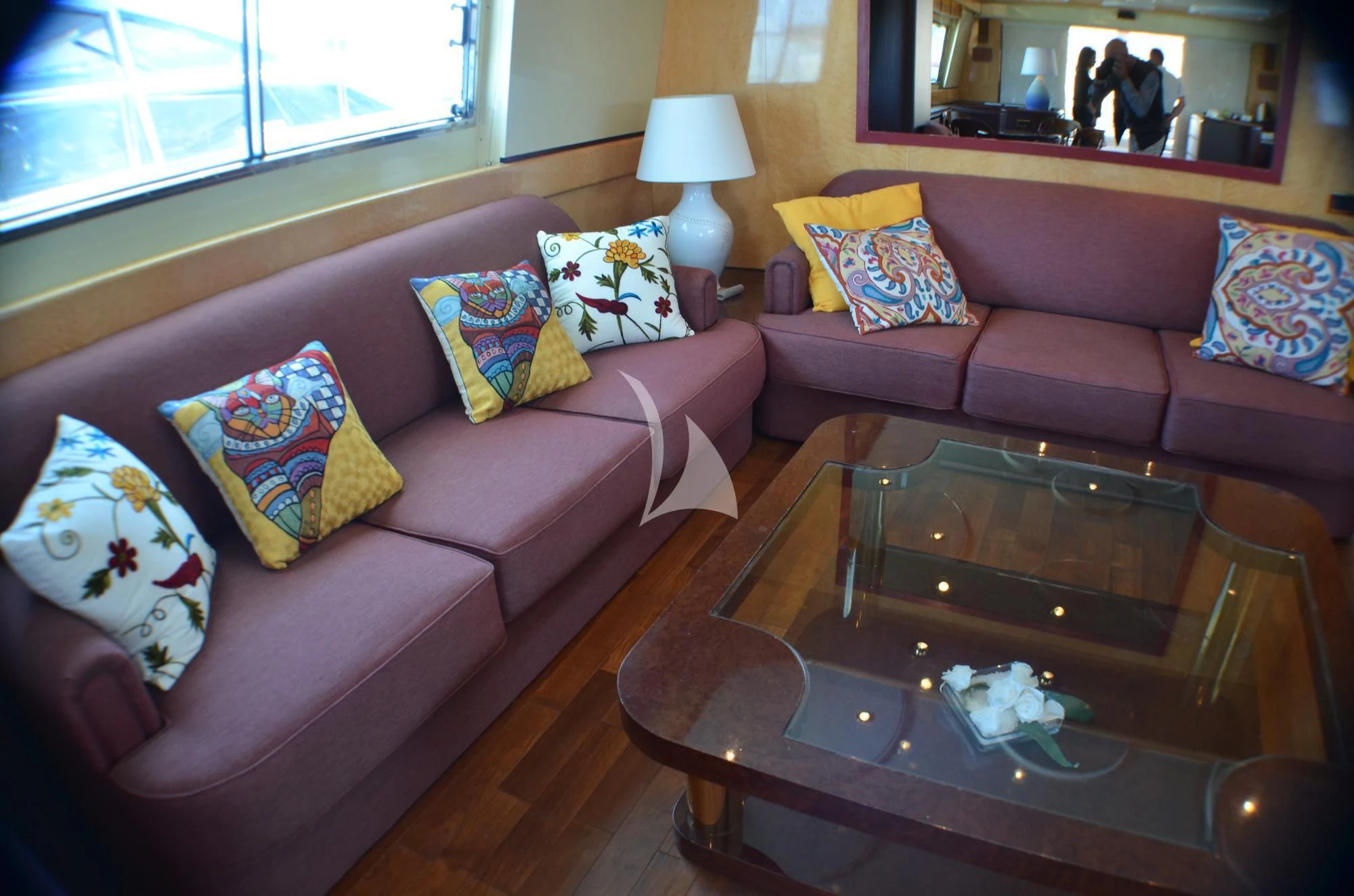 a living room with a couch and coffee table aboard MISS CANDY Yacht for Charter