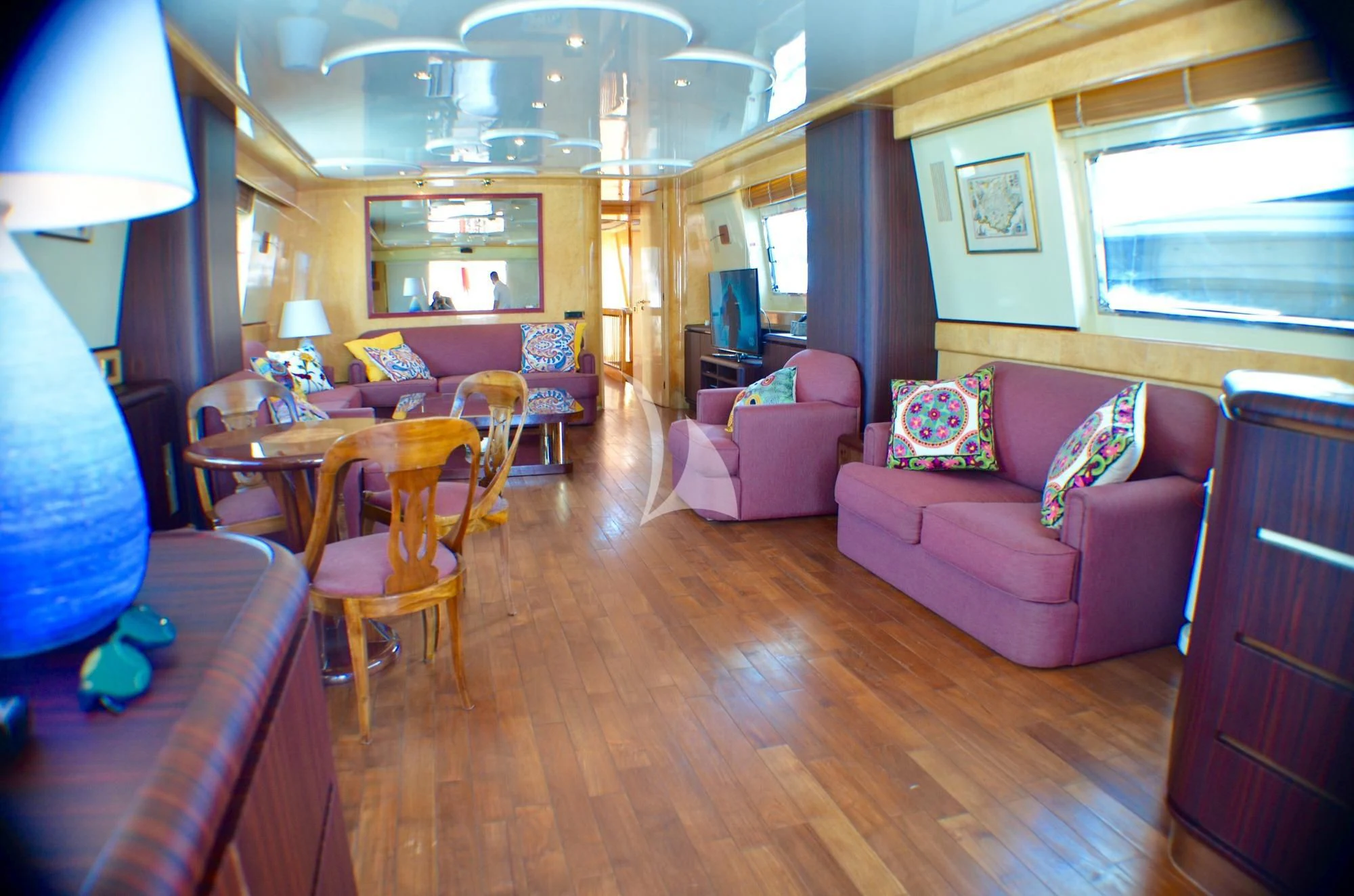 a living room with a pink couch aboard MISS CANDY Yacht for Charter