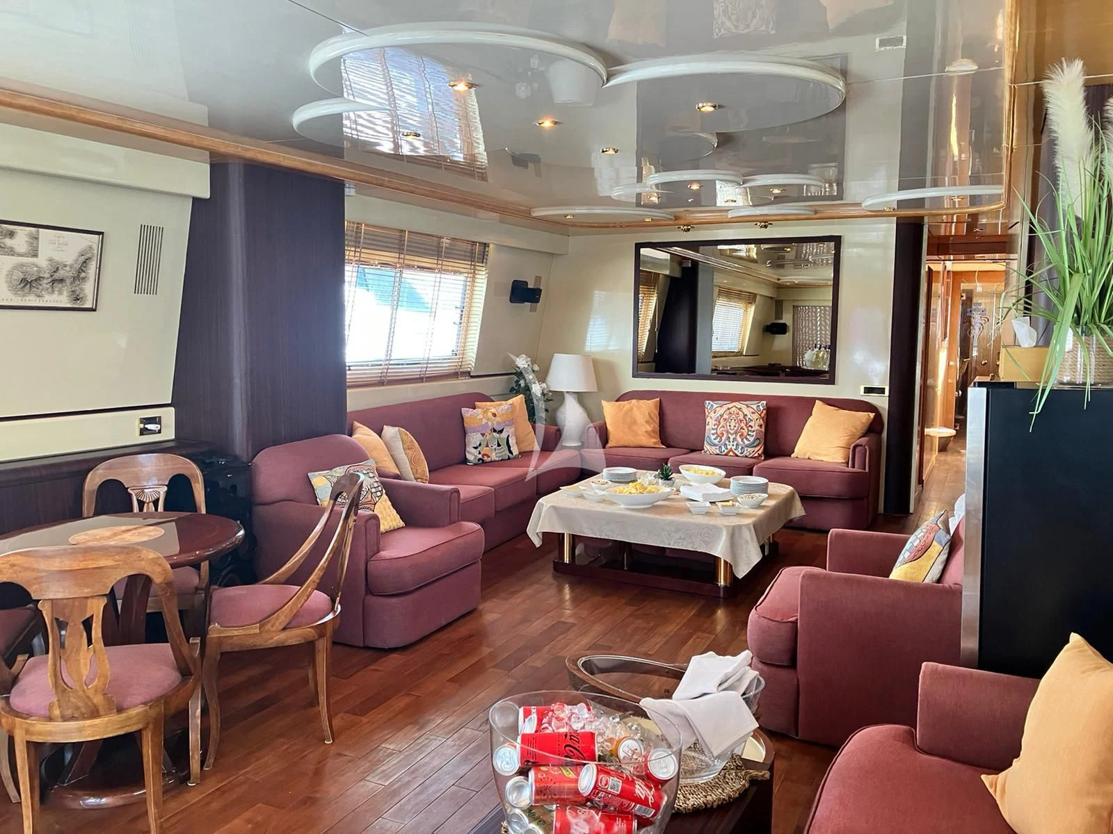 a living room with a couch and a table aboard MISS CANDY Yacht for Charter