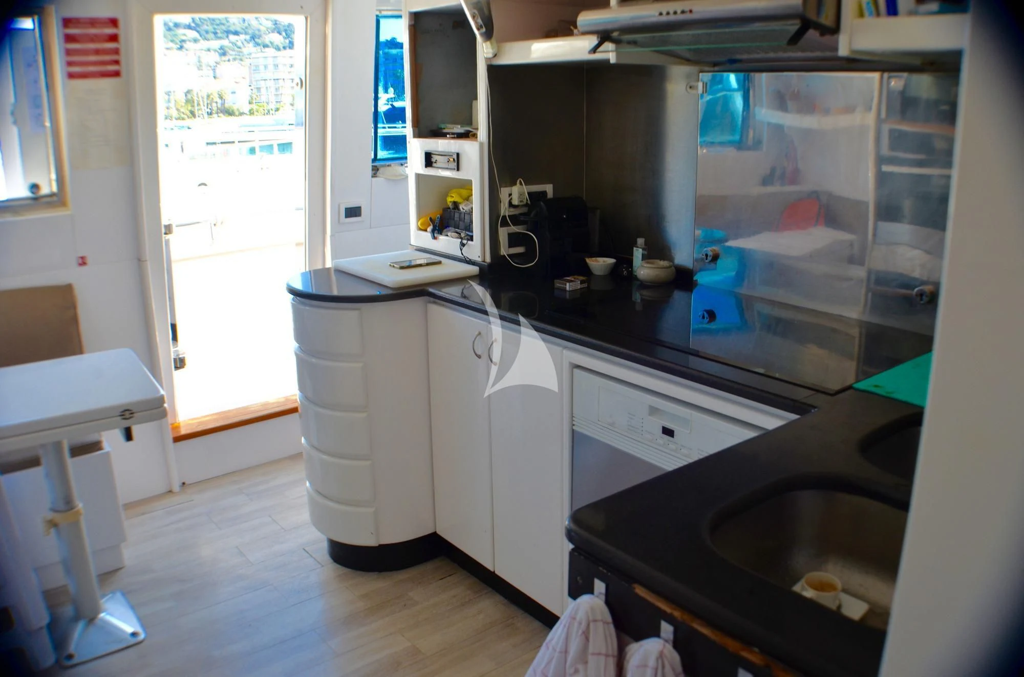 a kitchen with a sink and a microwave aboard MISS CANDY Yacht for Charter