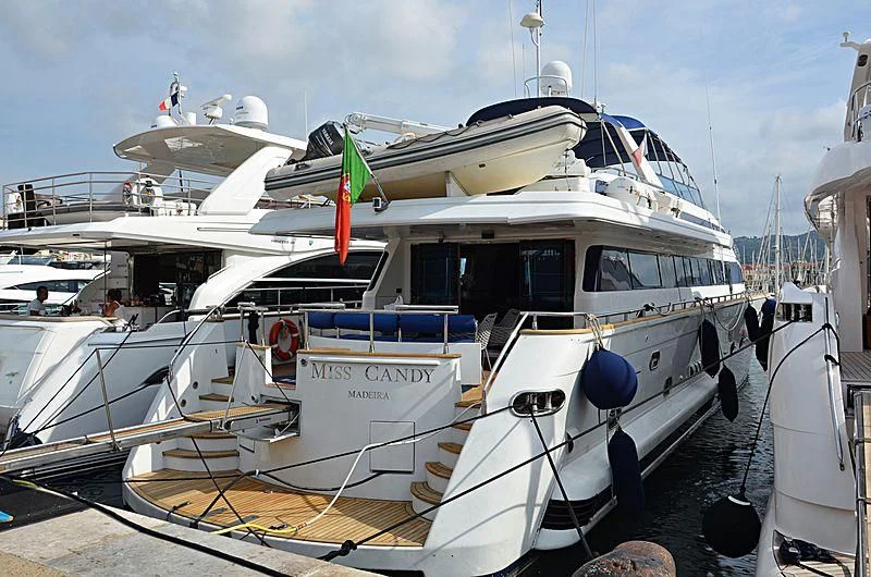 a boat docked at a pier aboard MISS CANDY Yacht for Charter