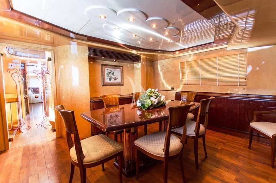 a dining room with a table and chairs aboard MISS CANDY Yacht for Charter