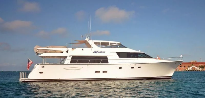 a white yacht in the water aboard HARBOR LADY Yacht for Sale