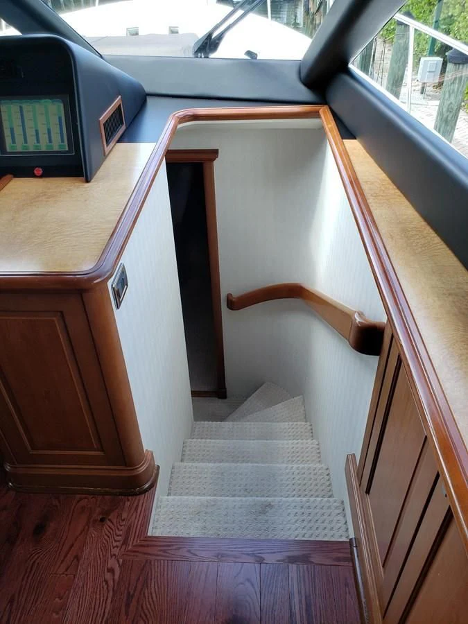 a wooden staircase in a car aboard HARBOR LADY Yacht for Sale