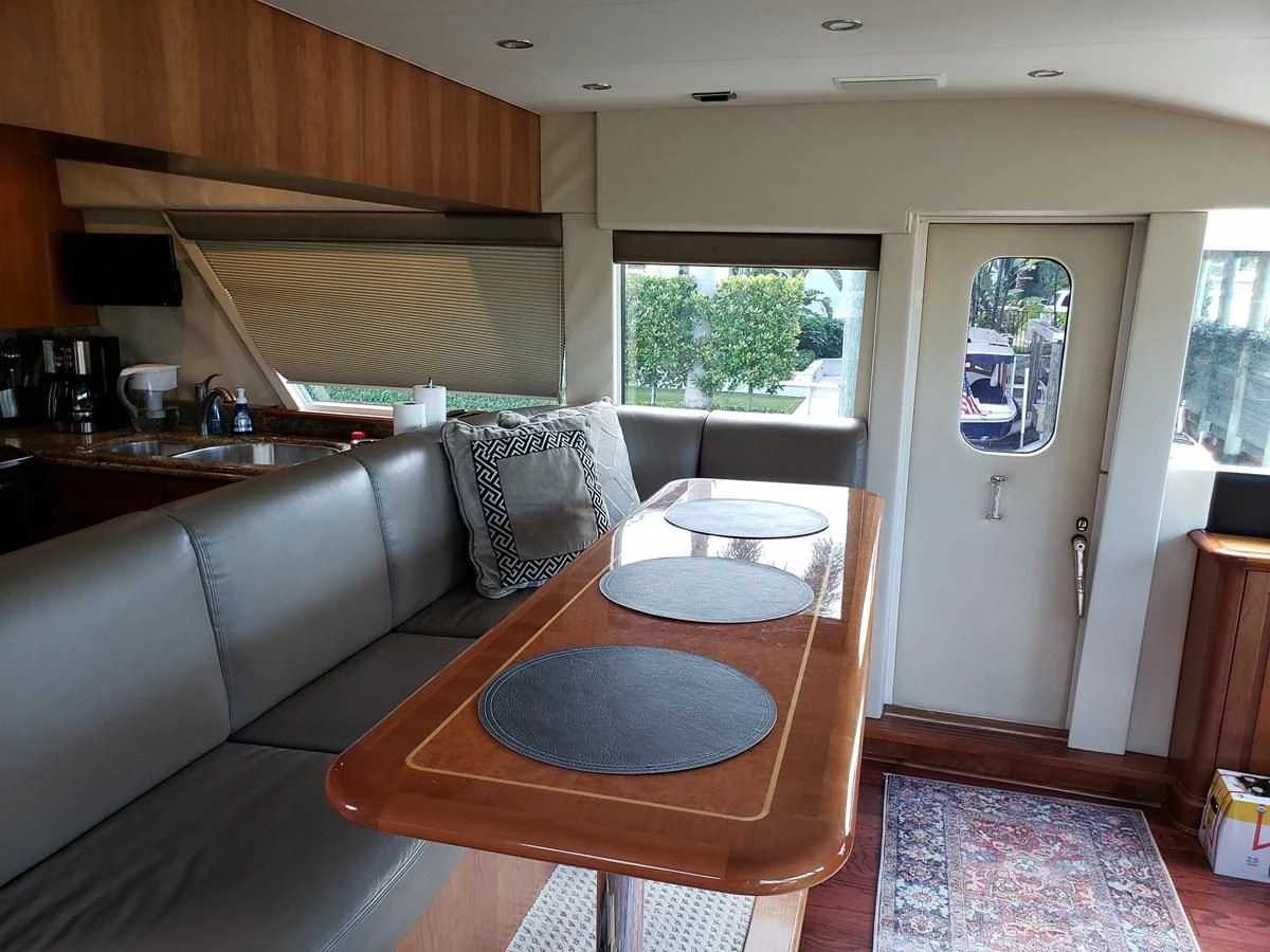 a living room with a couch and a table aboard HARBOR LADY Yacht for Sale