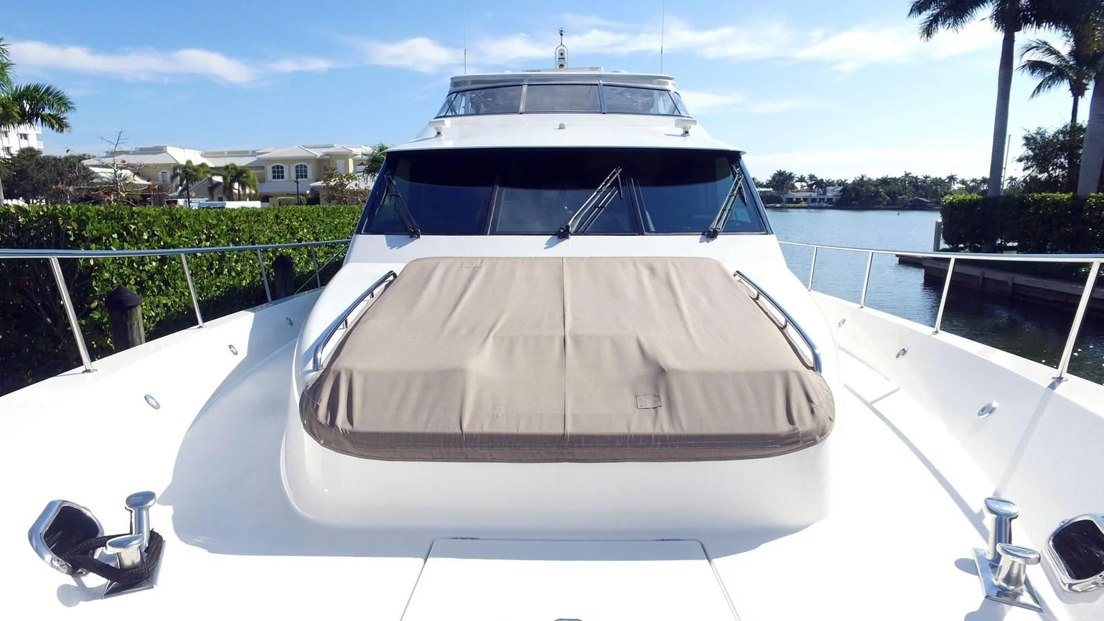 a white yacht on a dock aboard HARBOR LADY Yacht for Sale