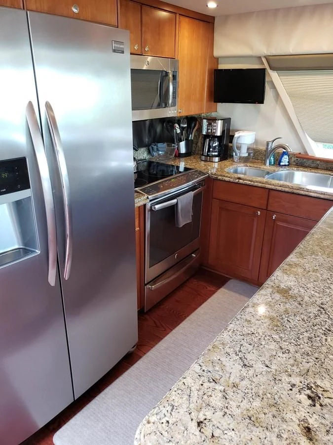 a kitchen with stainless steel appliances aboard HARBOR LADY Yacht for Sale