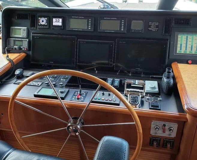 a wooden paneled panel with a black panel and a black panel aboard HARBOR LADY Yacht for Sale