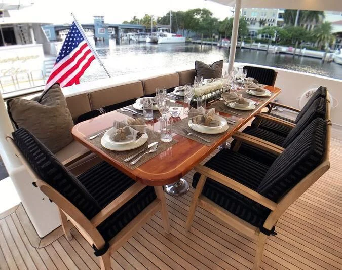 a table with food and drinks on it aboard HARBOR LADY Yacht for Sale