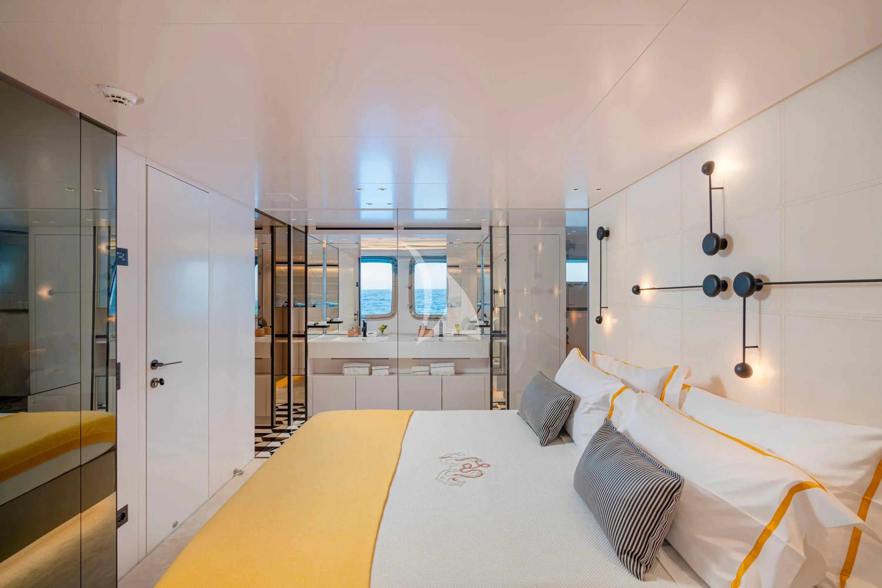 a bedroom with a bed and a closet aboard DANIDA Yacht for Charter