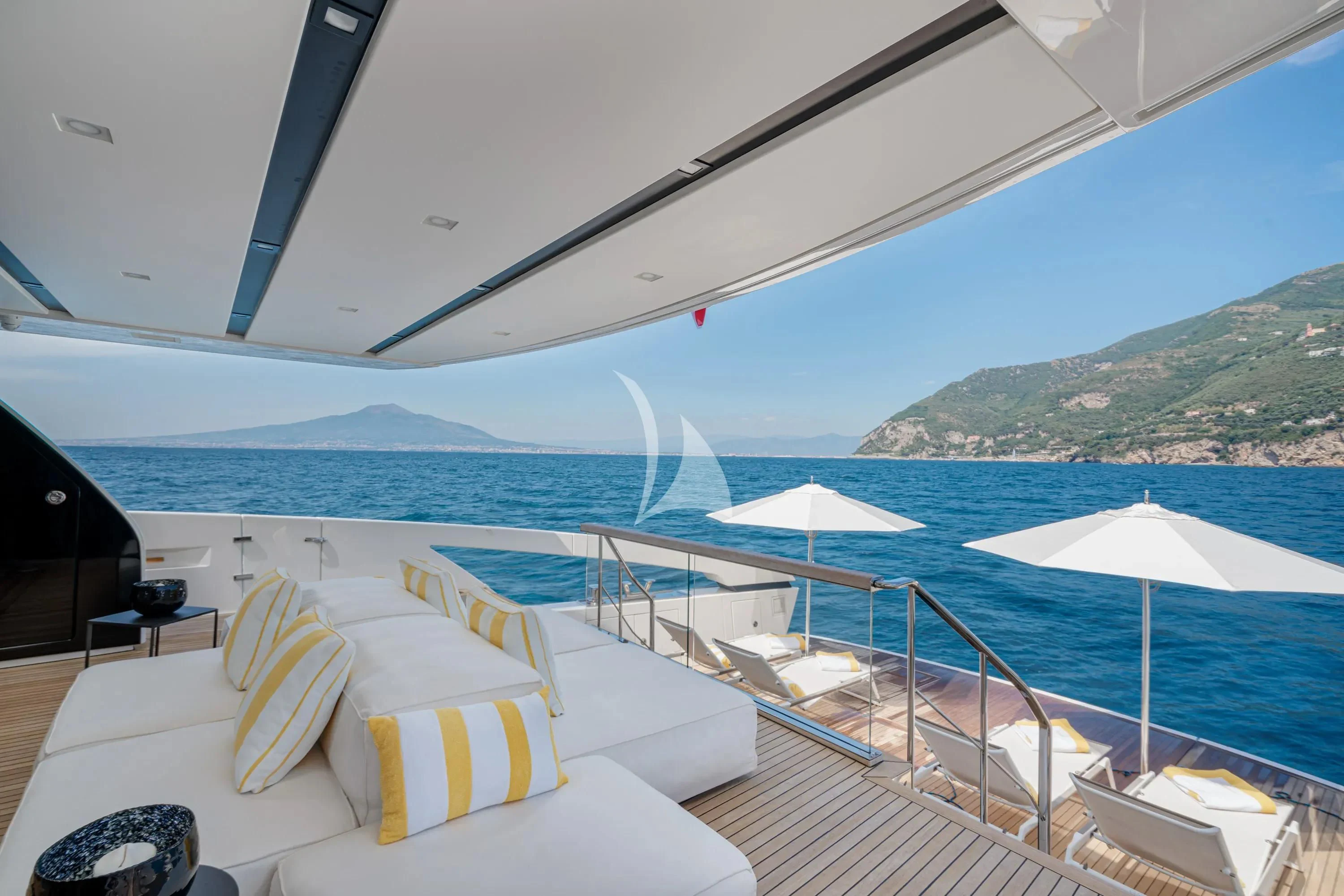 a deck with chairs and umbrellas aboard DANIDA Yacht for Charter
