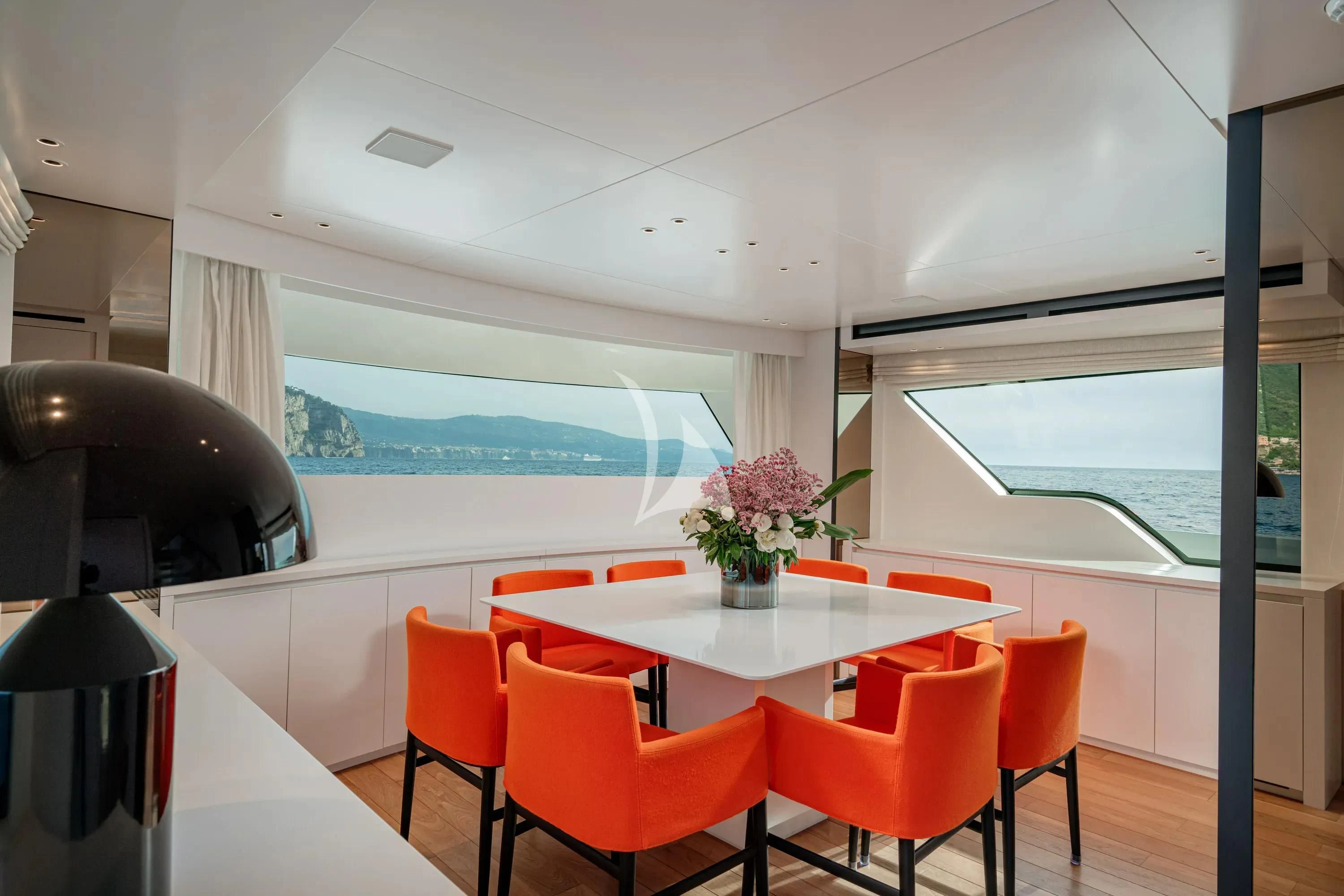 a room with a table and chairs aboard DANIDA Yacht for Charter