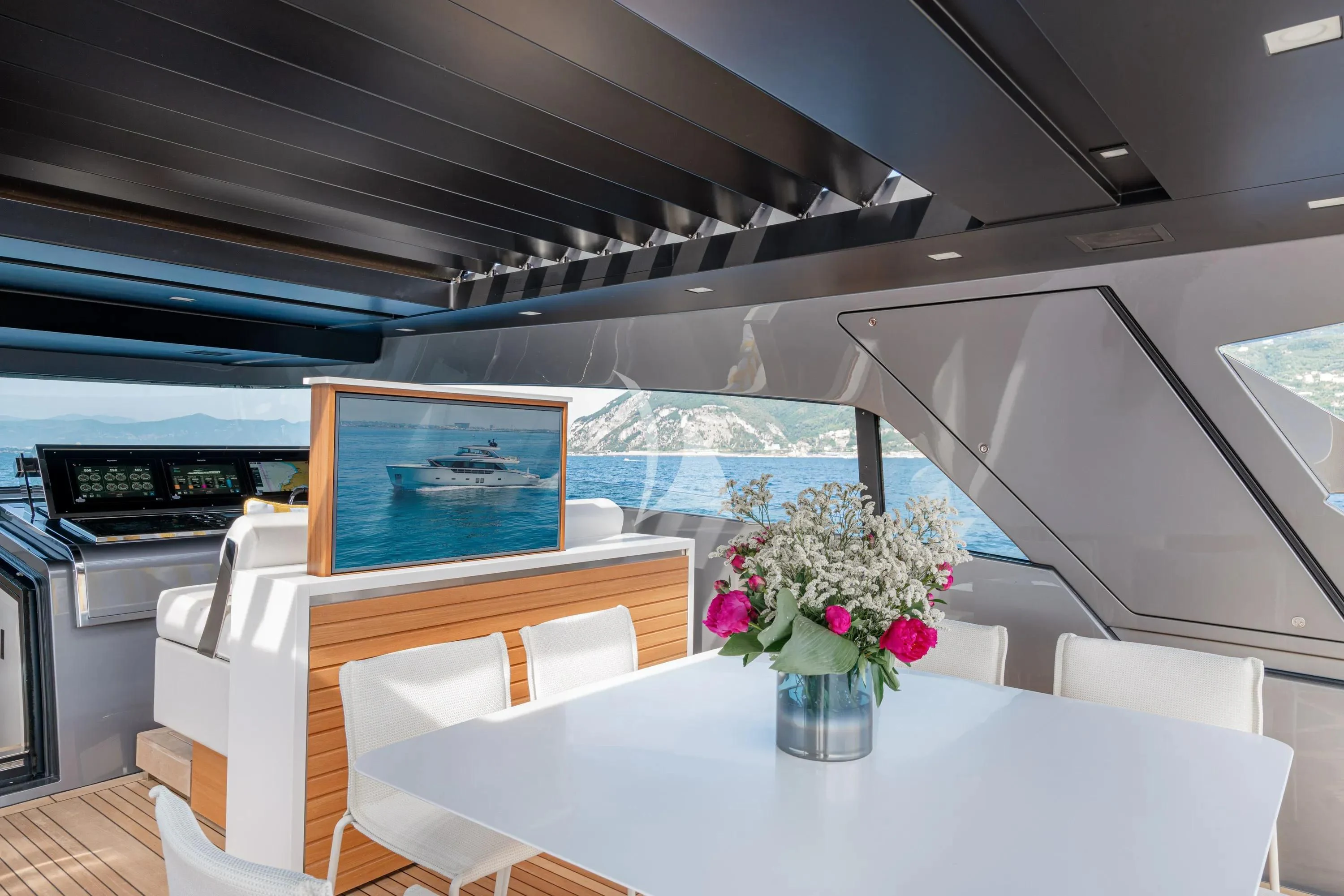 a room with a table and chairs aboard DANIDA Yacht for Charter
