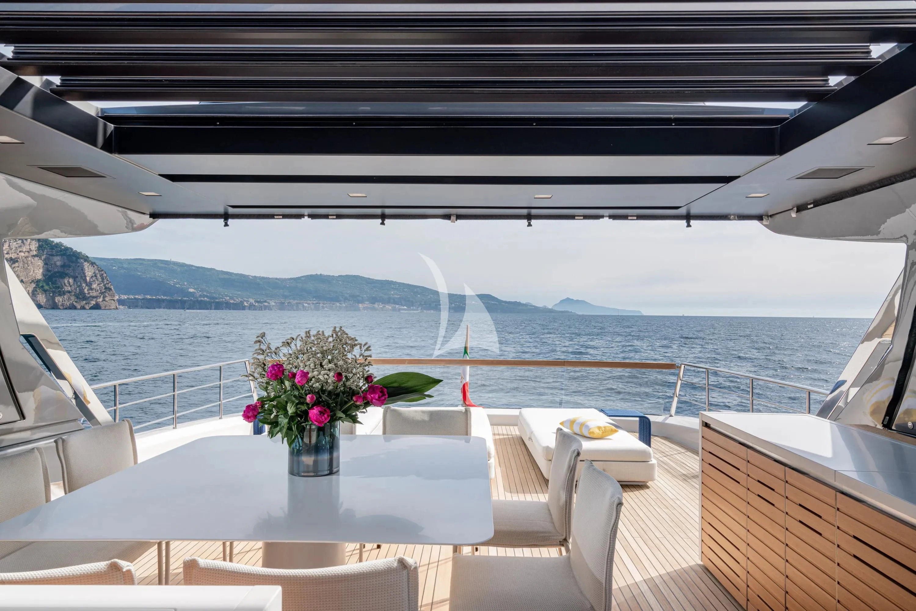 a table with flowers on it aboard DANIDA Yacht for Charter