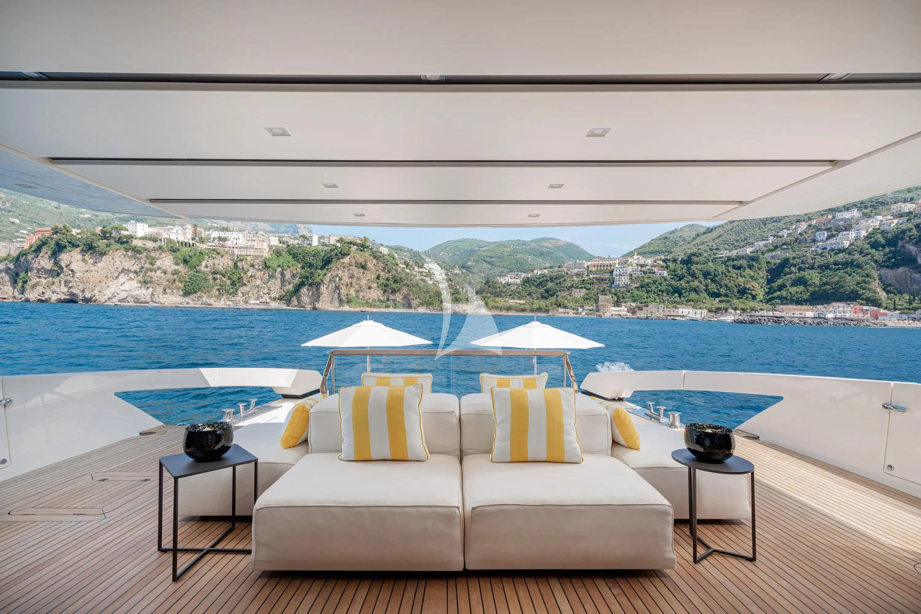 a room with a pool and a view of the mountains aboard DANIDA Yacht for Charter