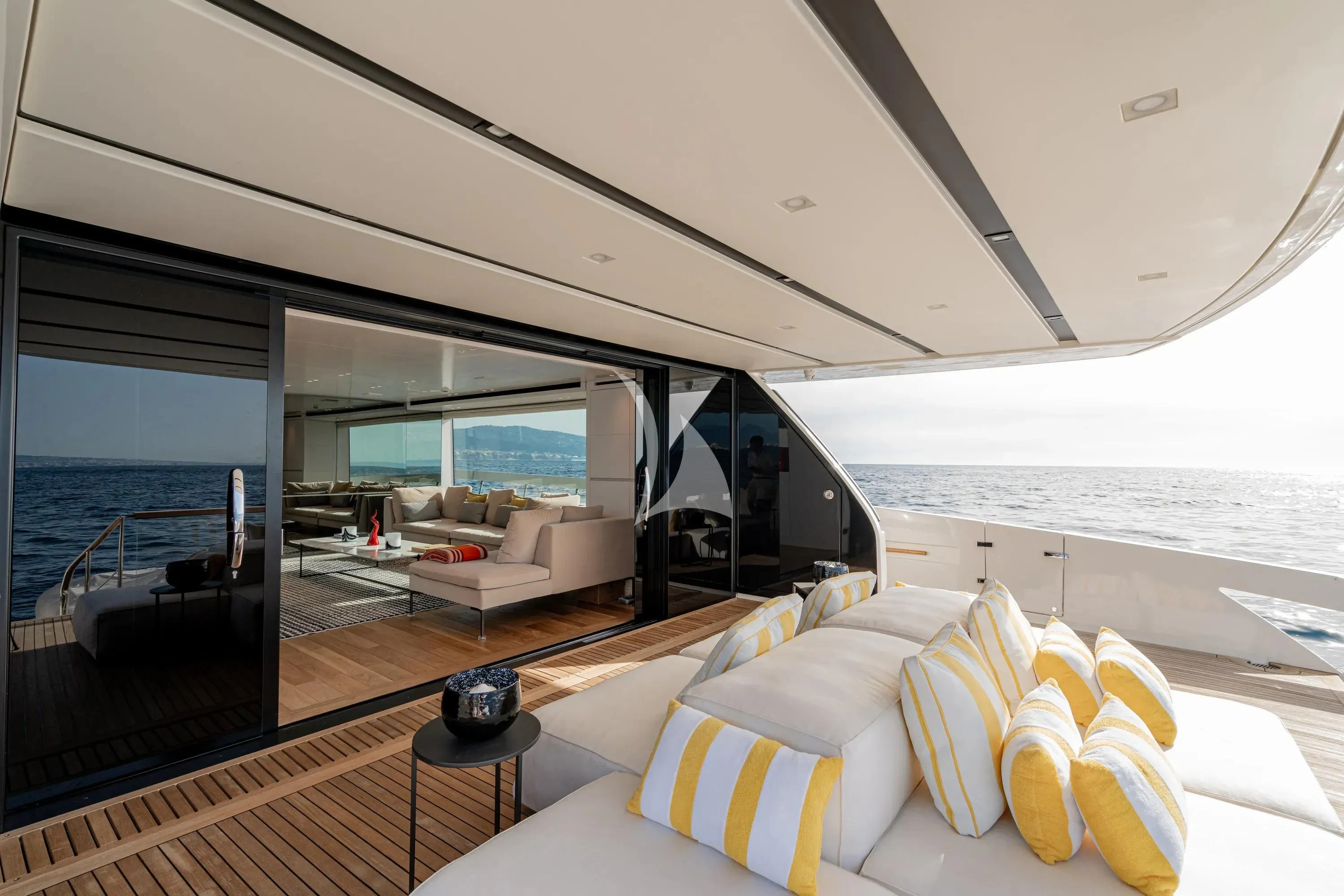 a room with a view of the ocean and the deck aboard DANIDA Yacht for Charter