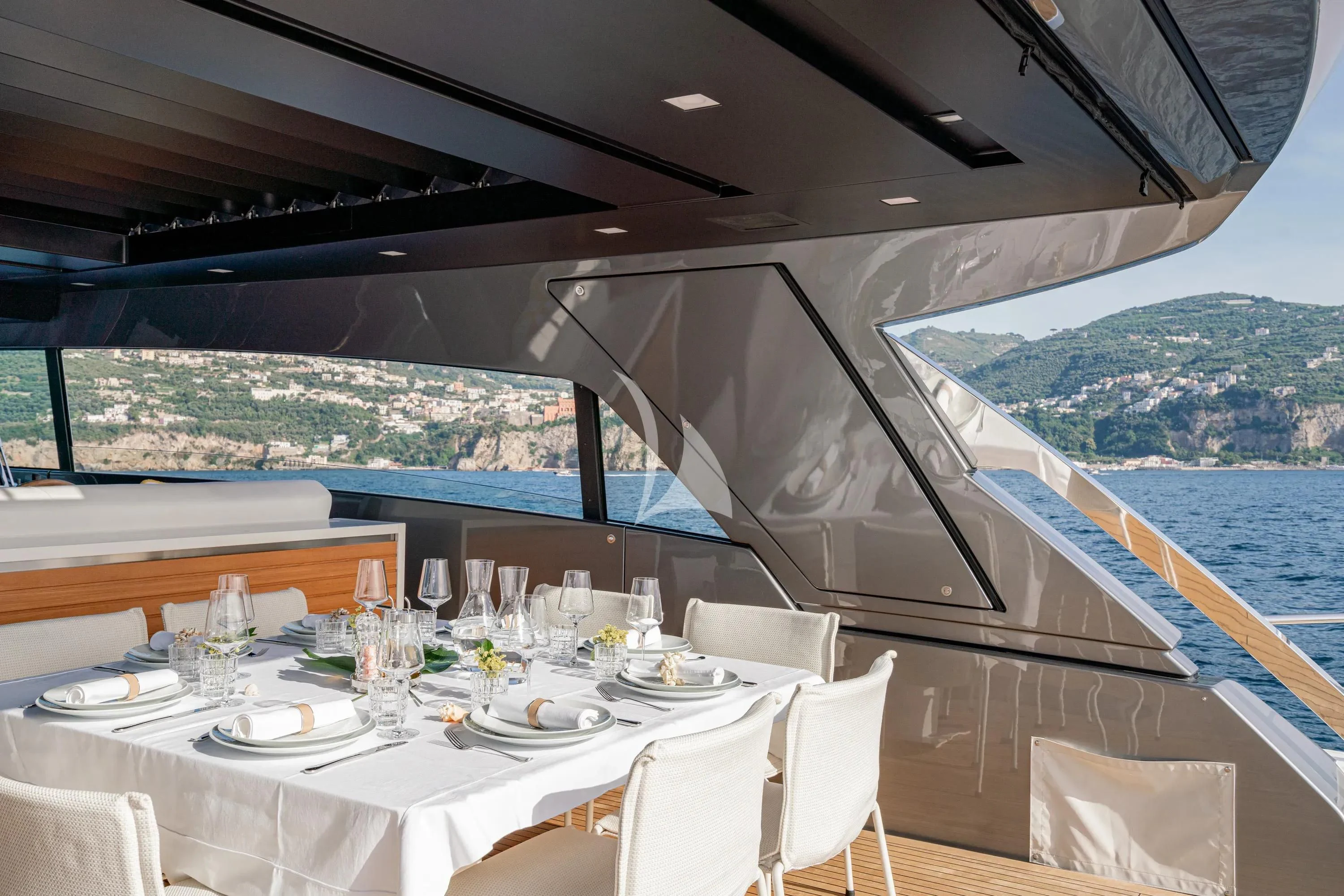 a table set for a meal on a boat aboard DANIDA Yacht for Charter