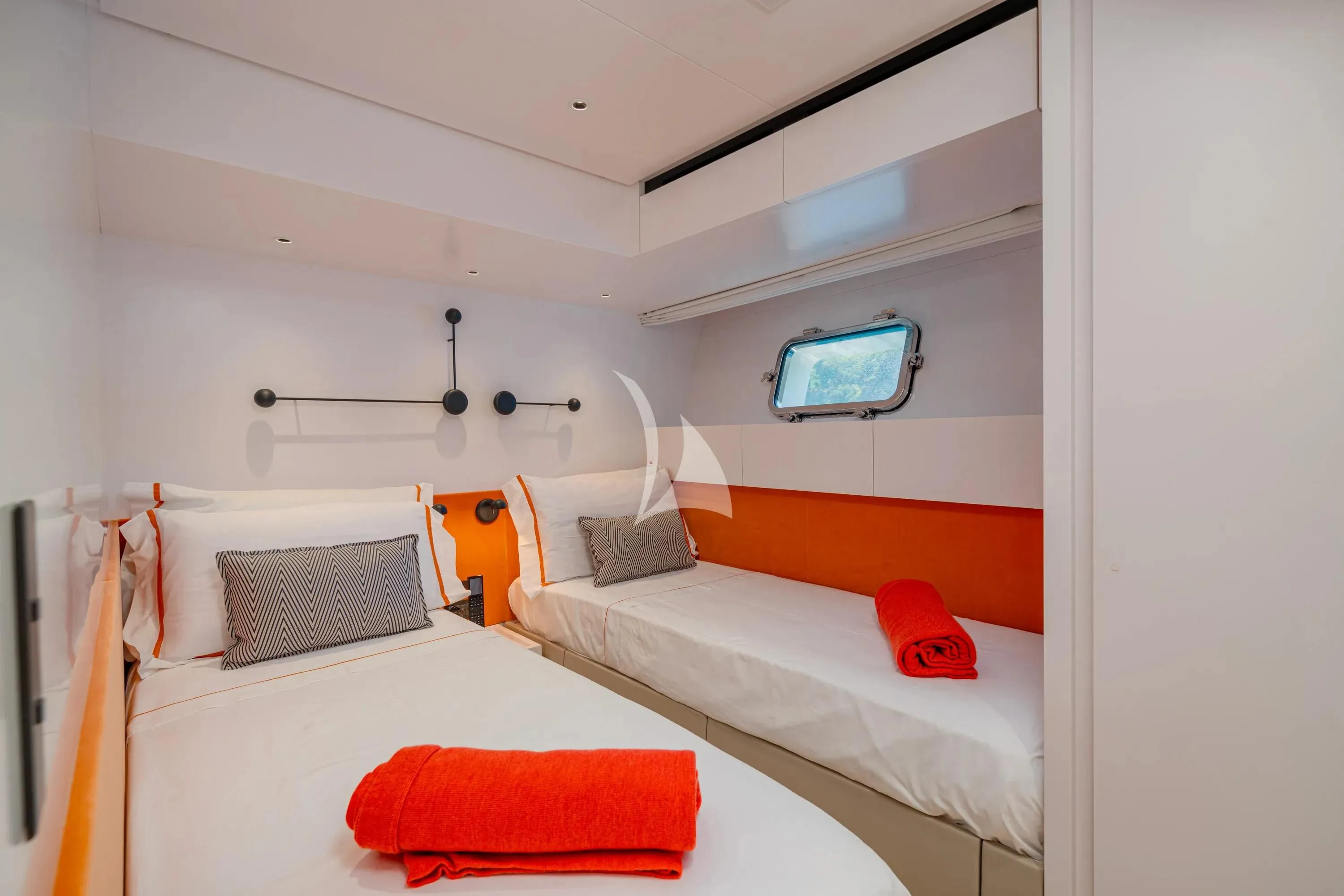 a room with two beds aboard DANIDA Yacht for Charter