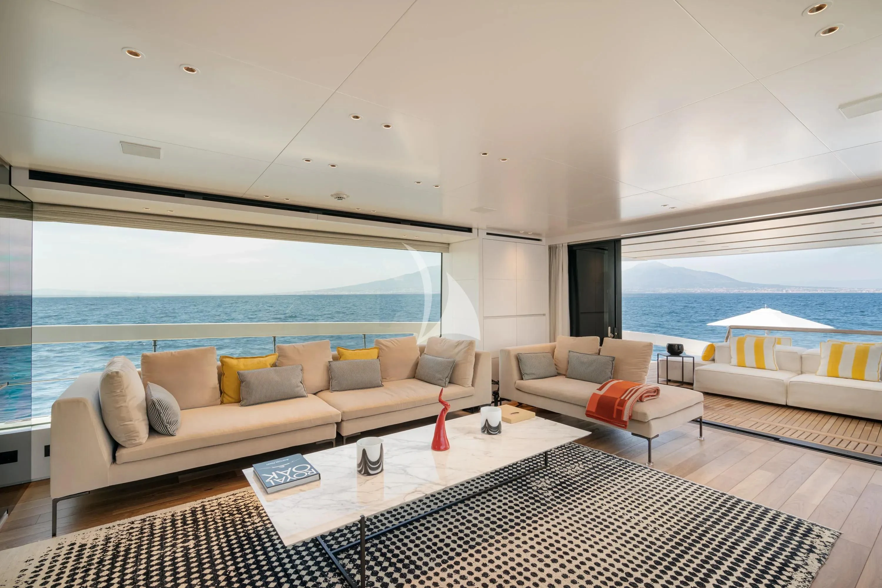 a living room with a large balcony aboard DANIDA Yacht for Charter