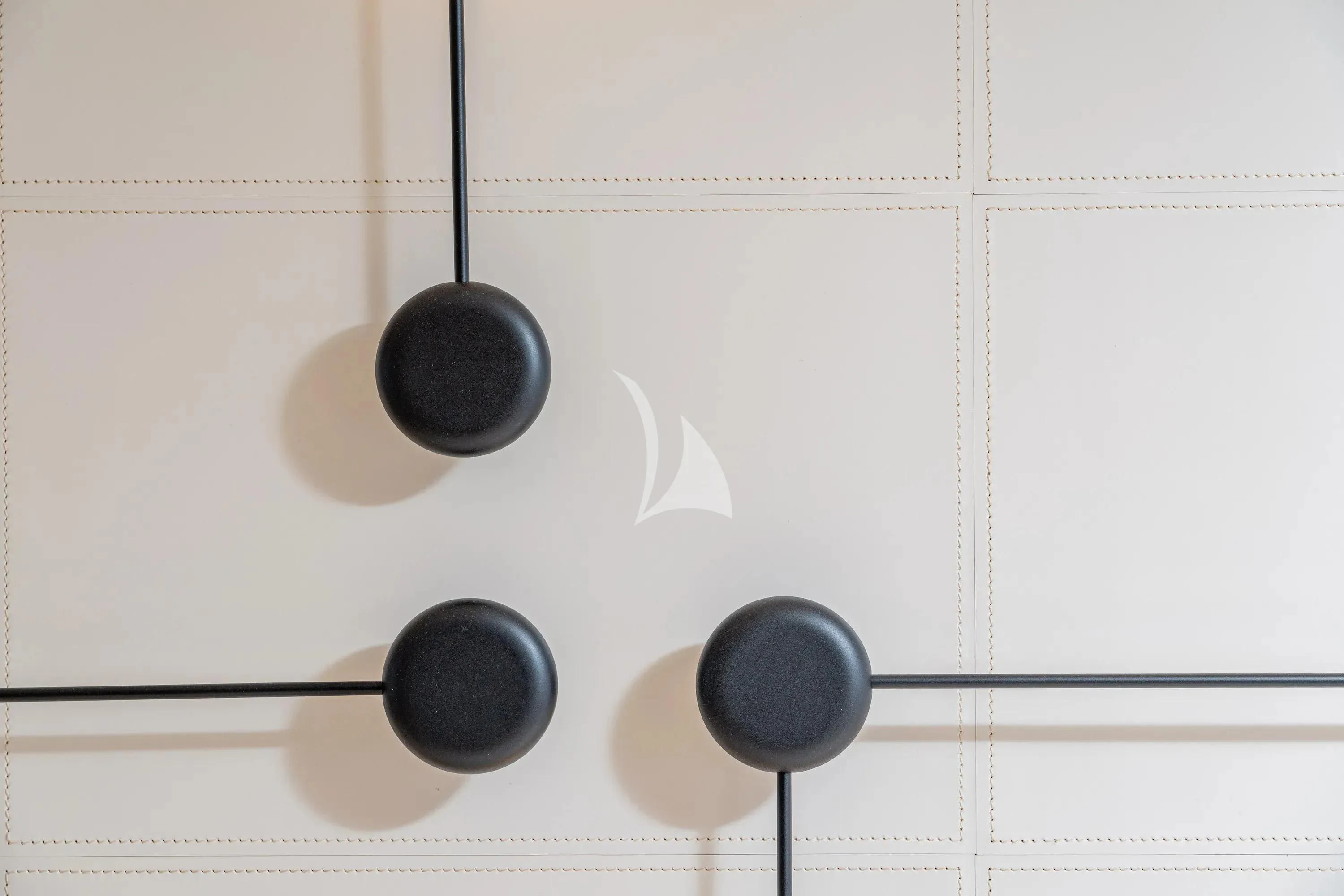 a pair of black balls from a string aboard DANIDA Yacht for Charter