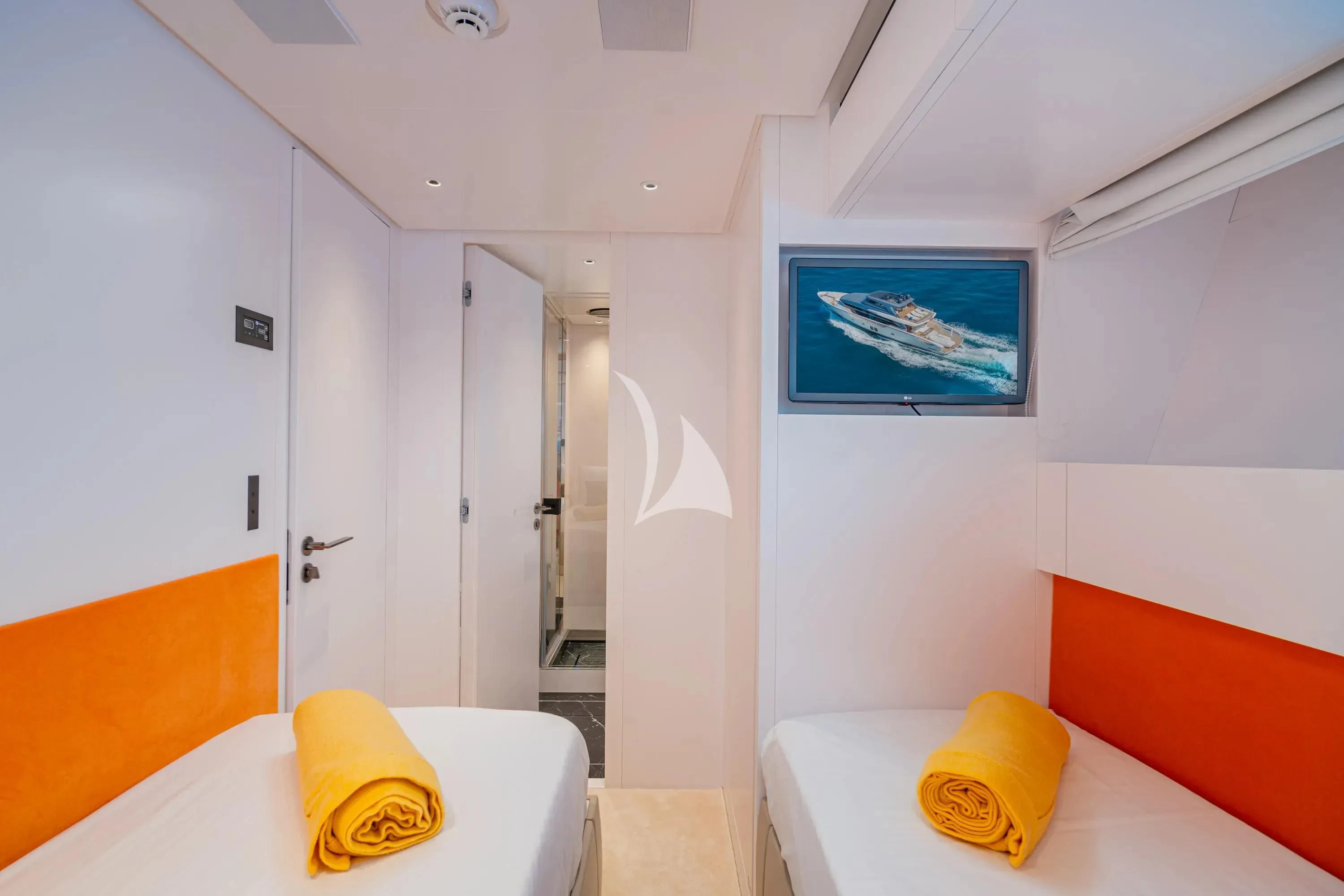 a room with a bed and a pillow aboard DANIDA Yacht for Charter