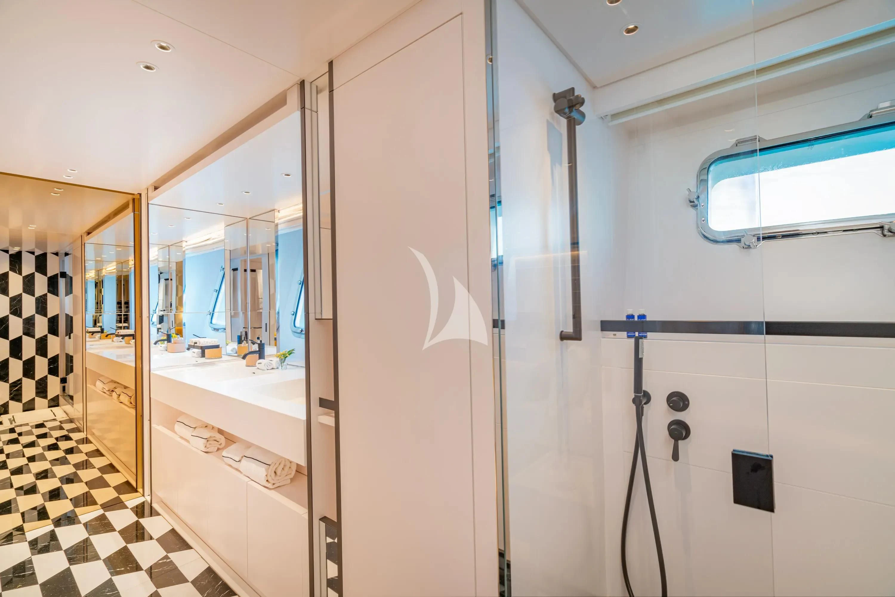 a bathroom with a mirror and a shower unit aboard DANIDA Yacht for Charter