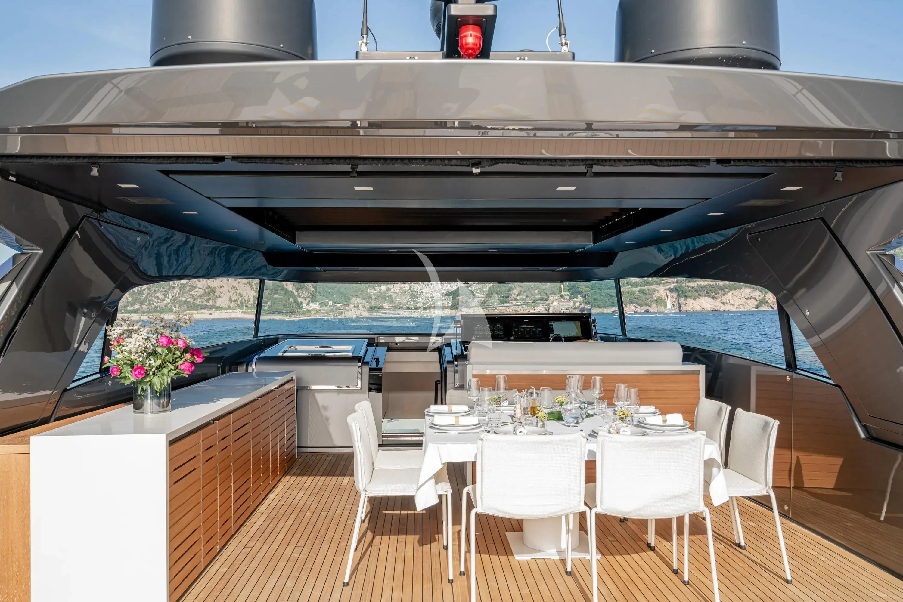 a room with tables and chairs aboard DANIDA Yacht for Charter