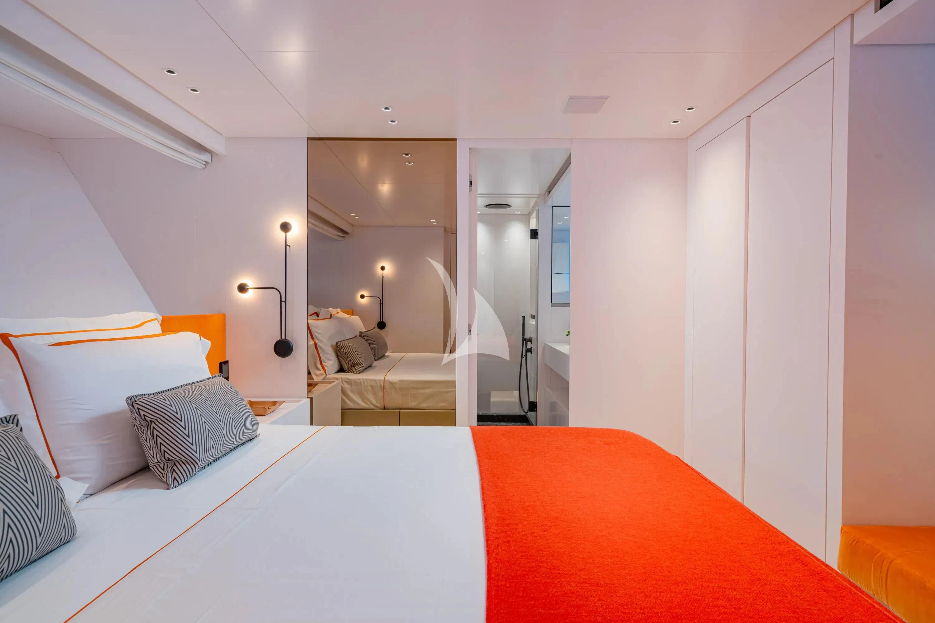 a bedroom with a bed and a couch aboard DANIDA Yacht for Charter