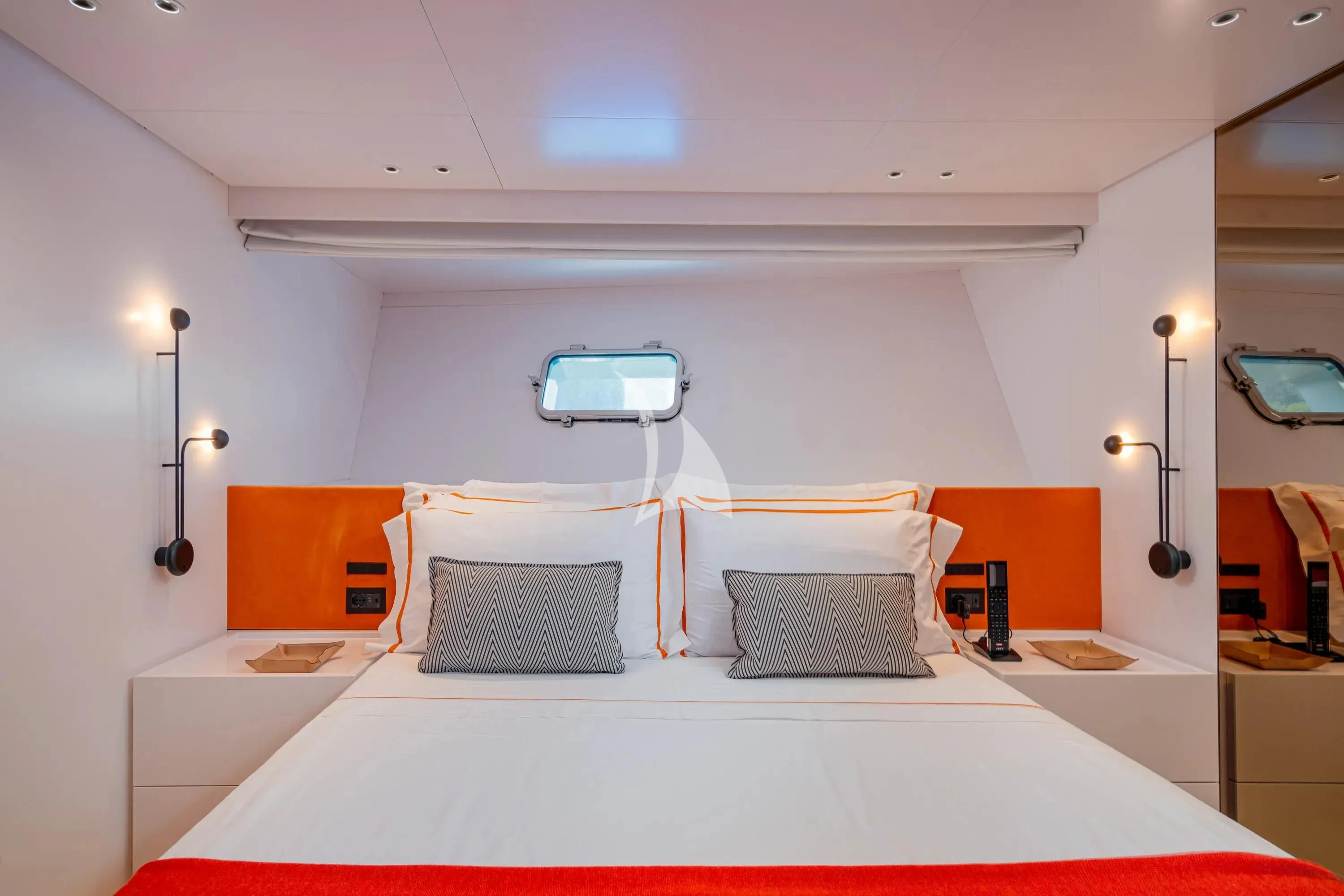 a room with a bed and a laptop on the bed aboard DANIDA Yacht for Charter