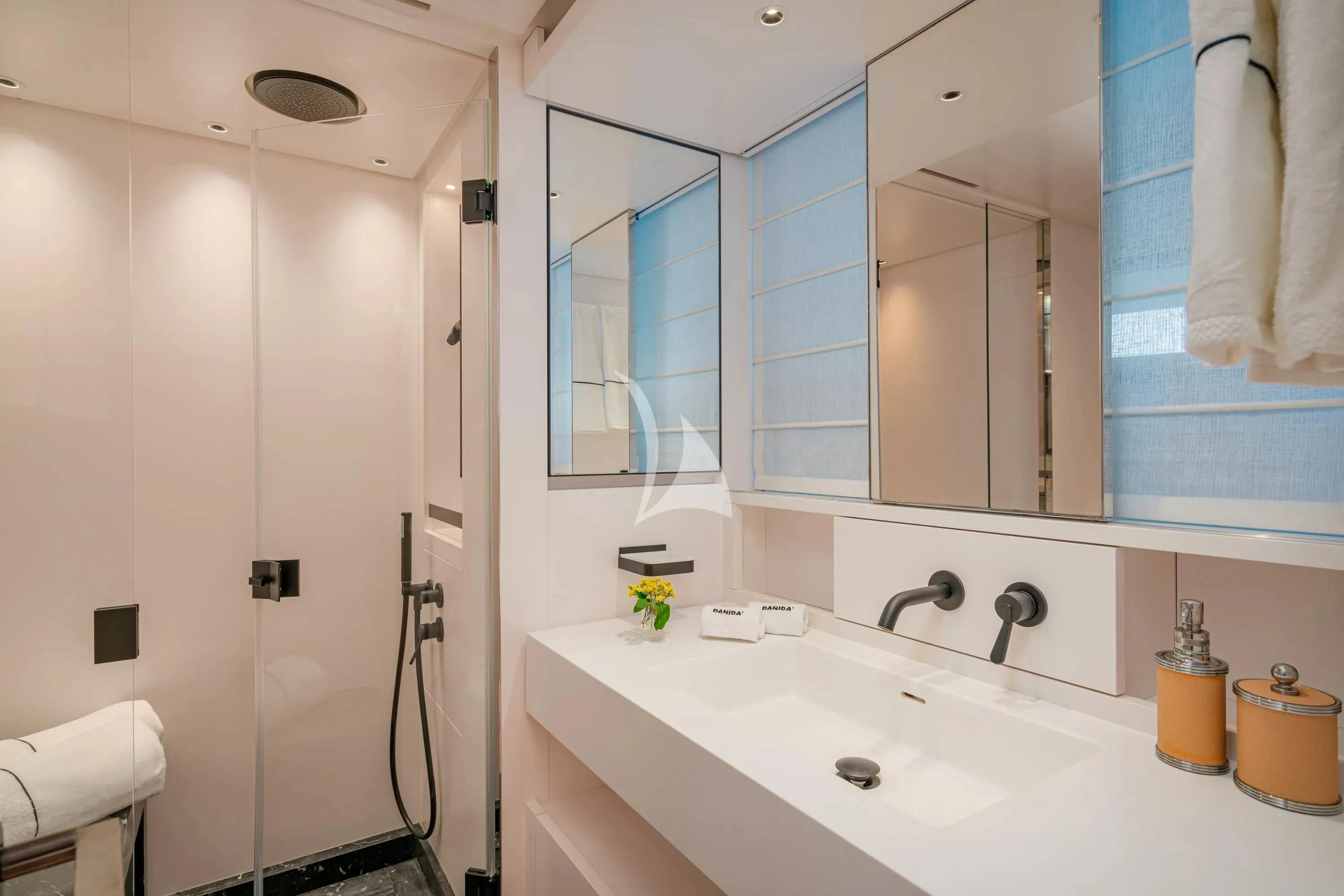a bathroom with a sink and mirror aboard DANIDA Yacht for Charter