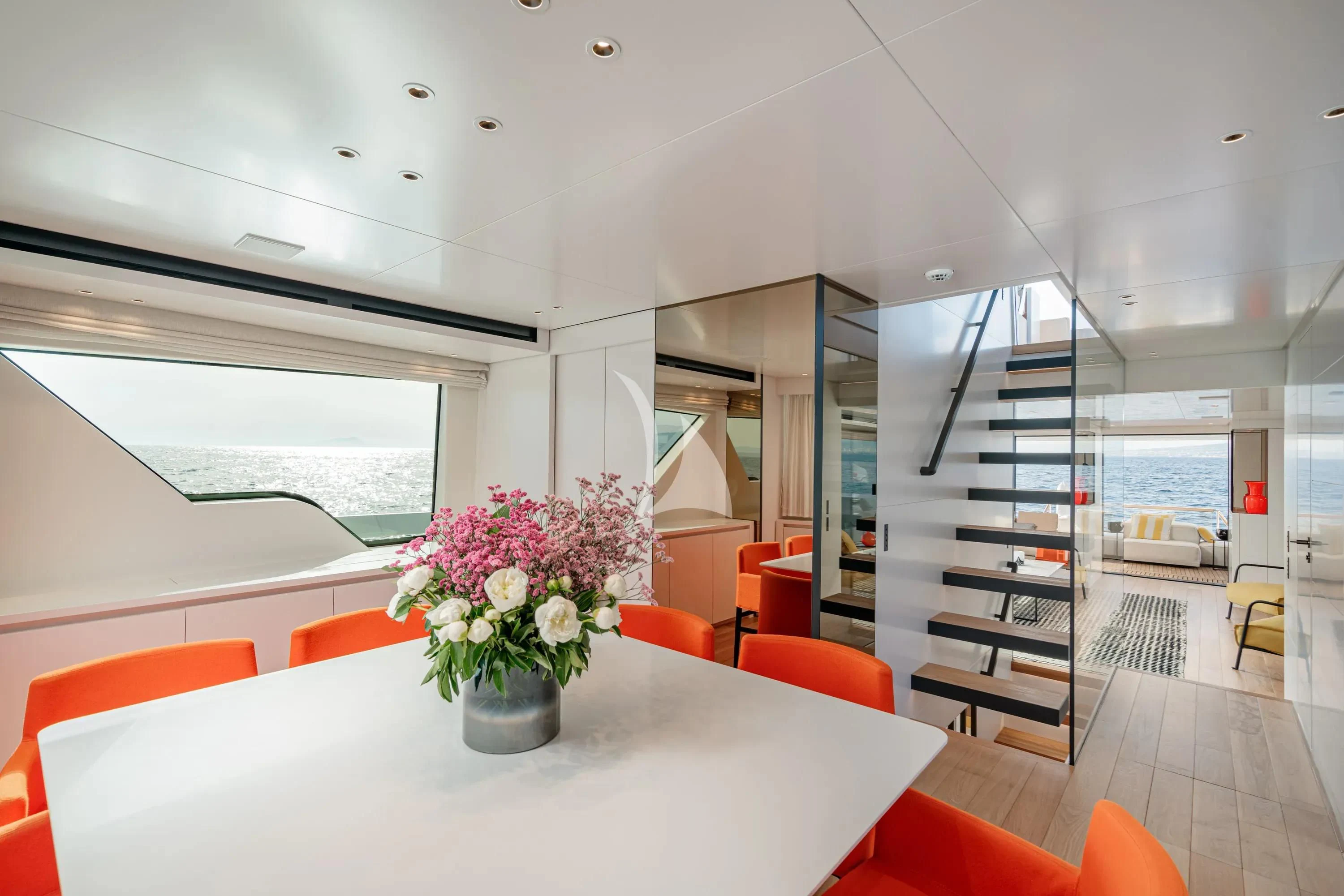a room with a table and chairs aboard DANIDA Yacht for Charter