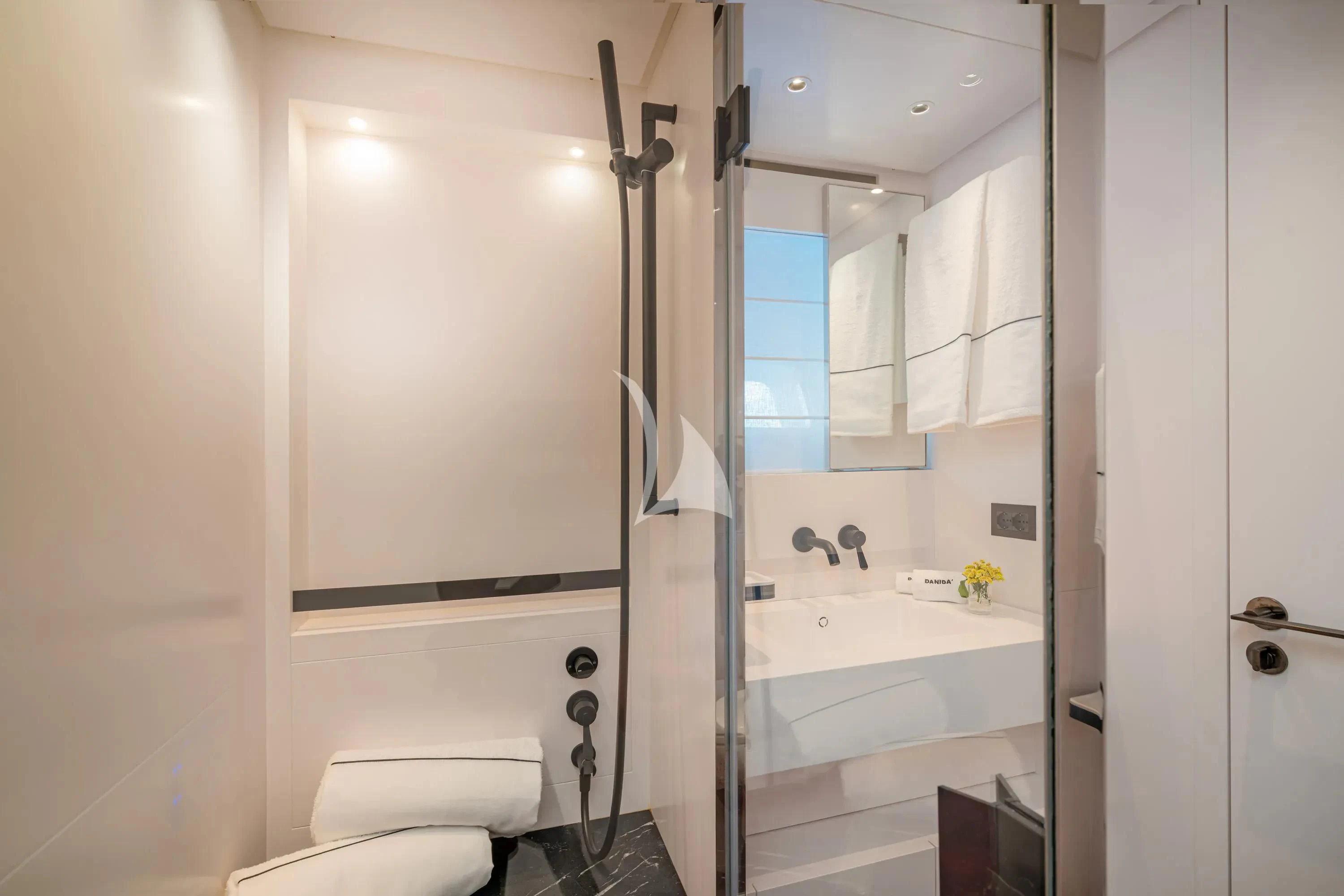 a bathroom with a tub sink and toilet aboard DANIDA Yacht for Charter