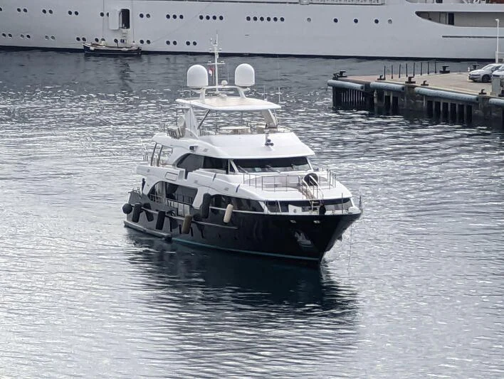 a large white boat in the water aboard ITHAKA Yacht for Sale