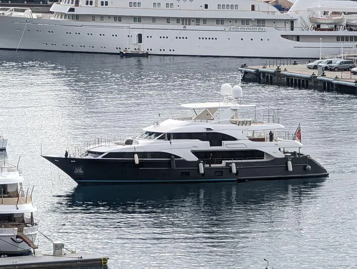 a large ship in the water aboard ITHAKA Yacht for Sale