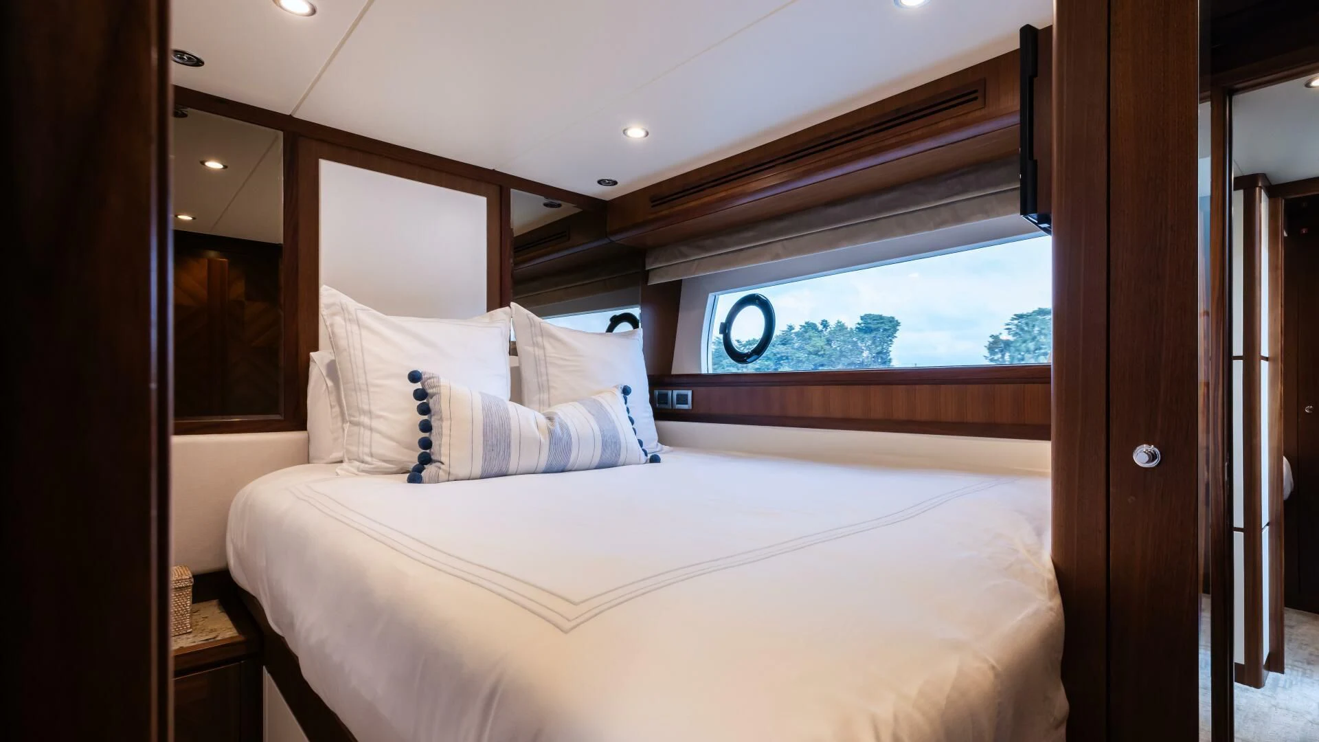 a bed with white sheets aboard CRUMDALE Yacht for Sale