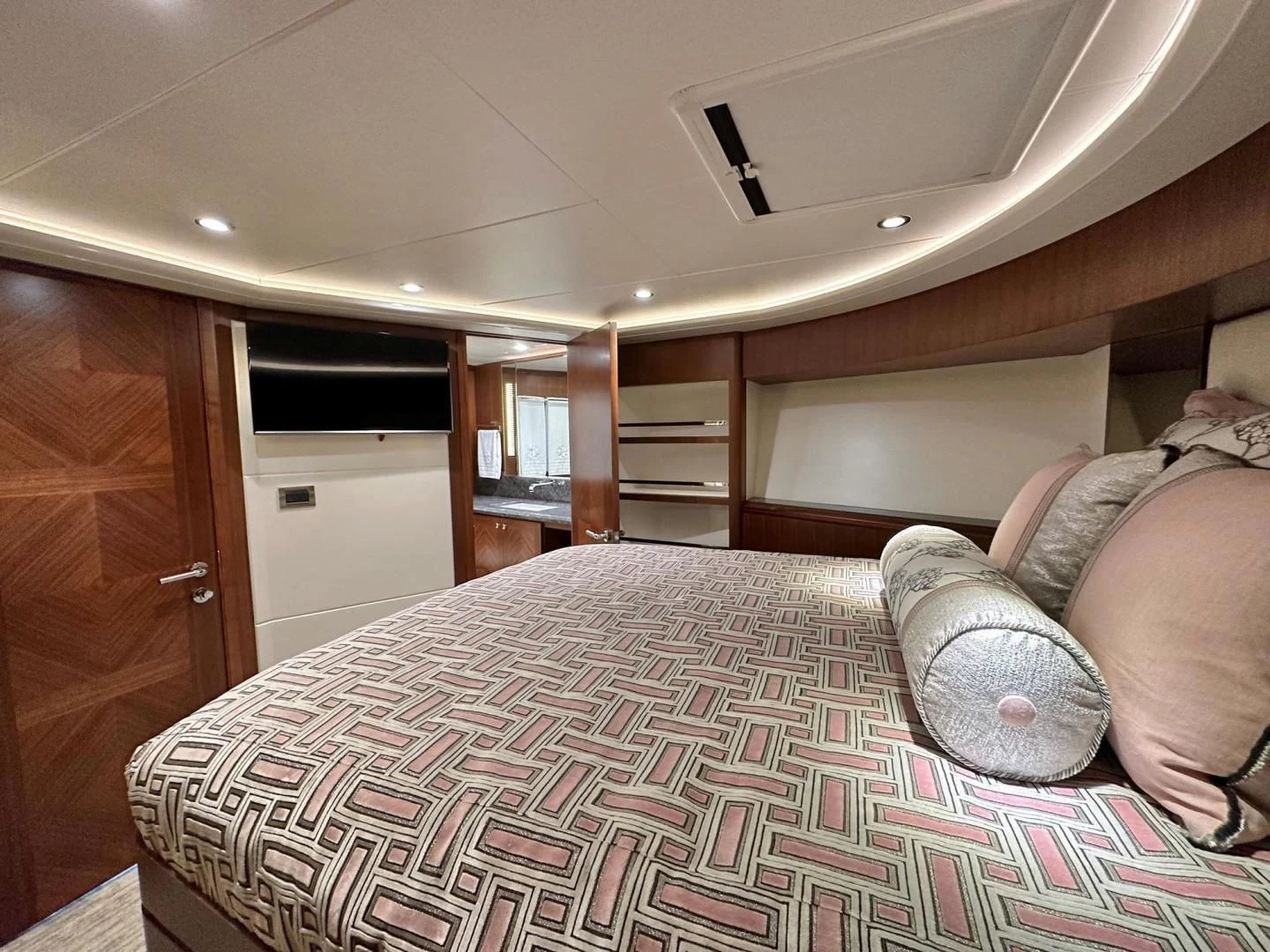 a bedroom with a large bed aboard CRUMDALE Yacht for Sale