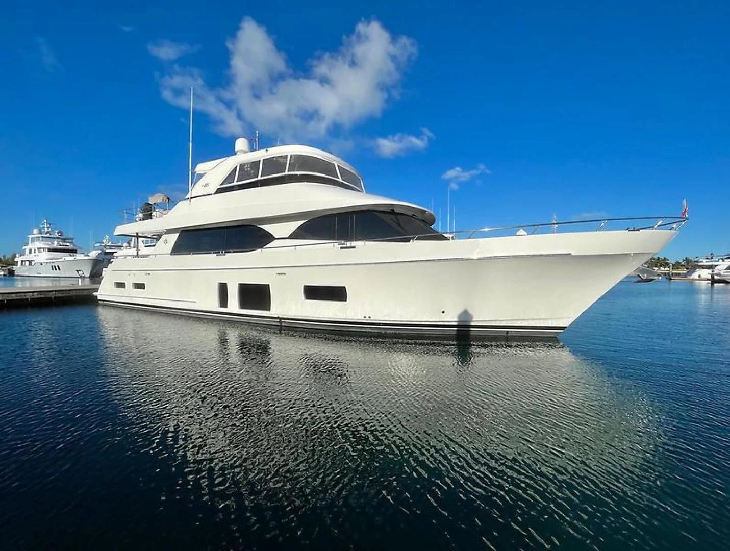 a white yacht in the water aboard CRUMDALE Yacht for Sale