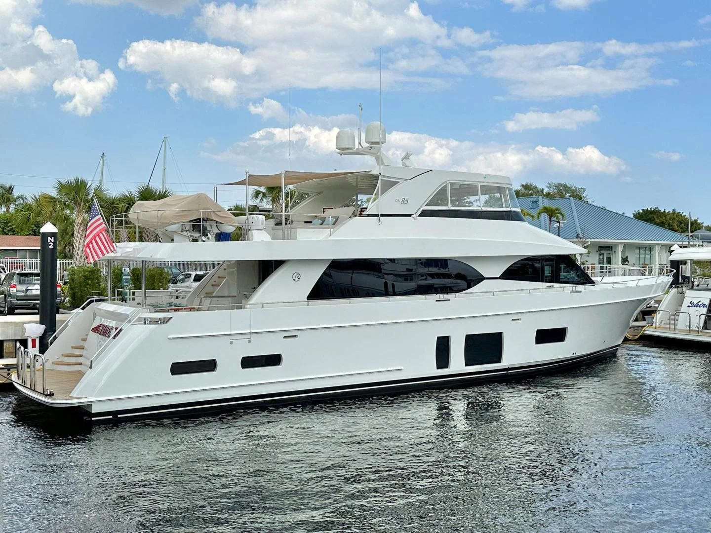 a white yacht docked aboard CRUMDALE Yacht for Sale
