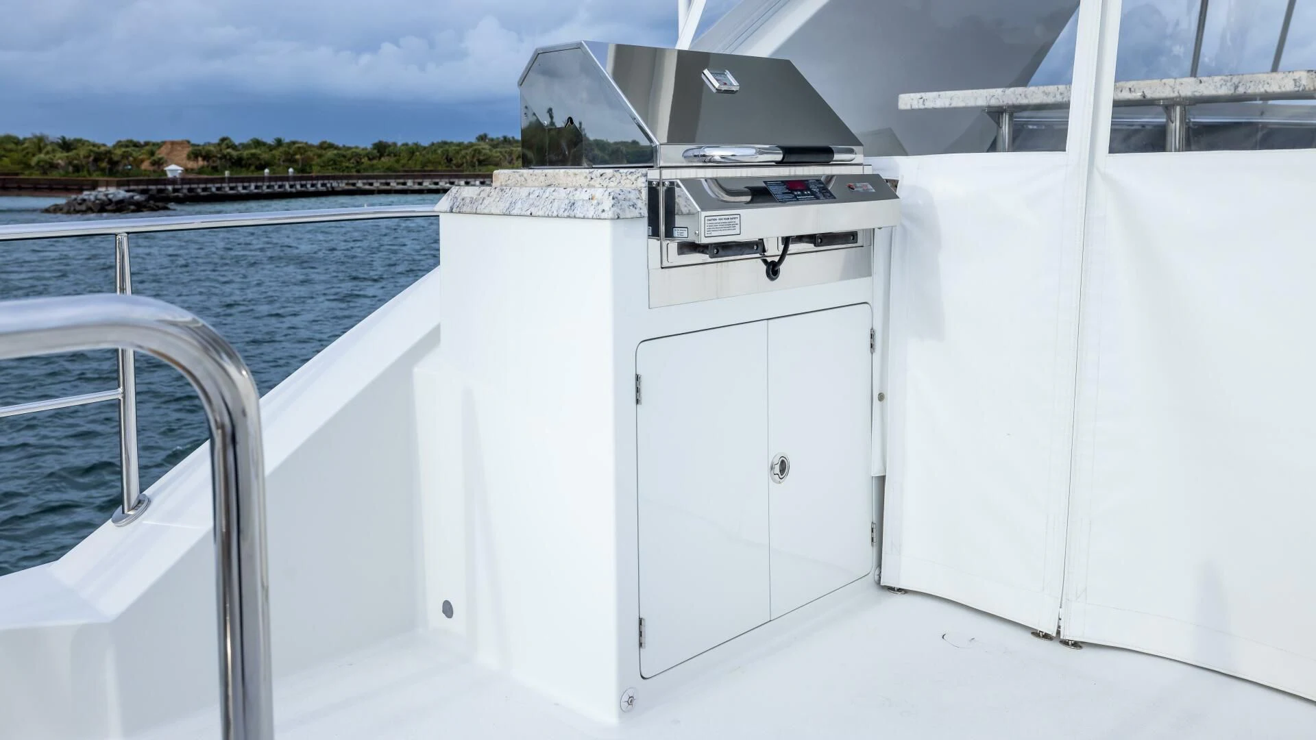a white boat on a body of water aboard CRUMDALE Yacht for Sale