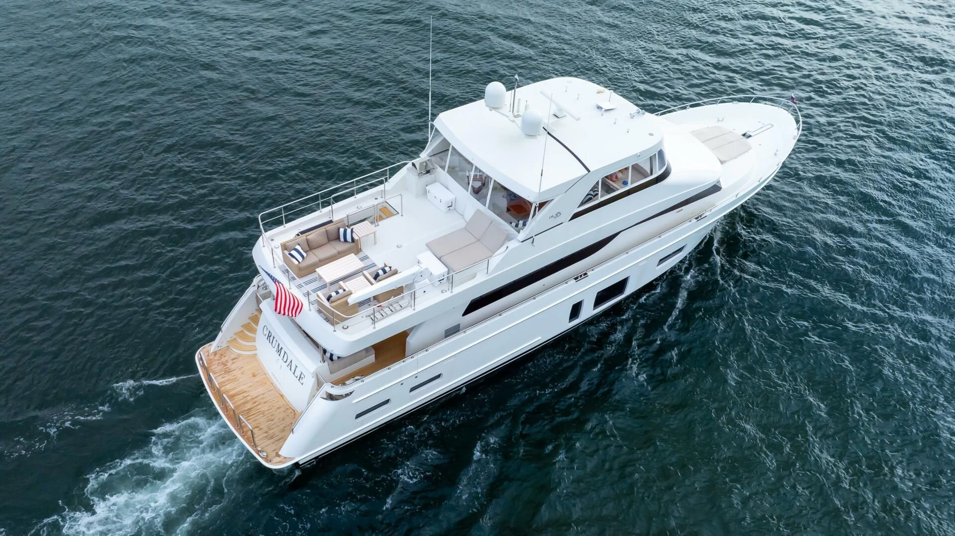 a white boat in the water aboard CRUMDALE Yacht for Sale