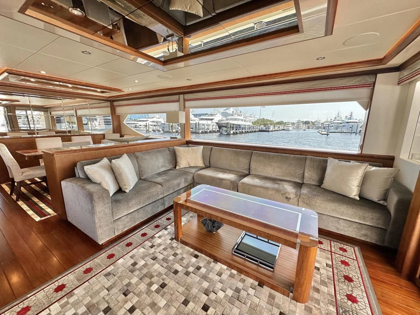 a living room with a couch and a table aboard CRUMDALE Yacht for Sale