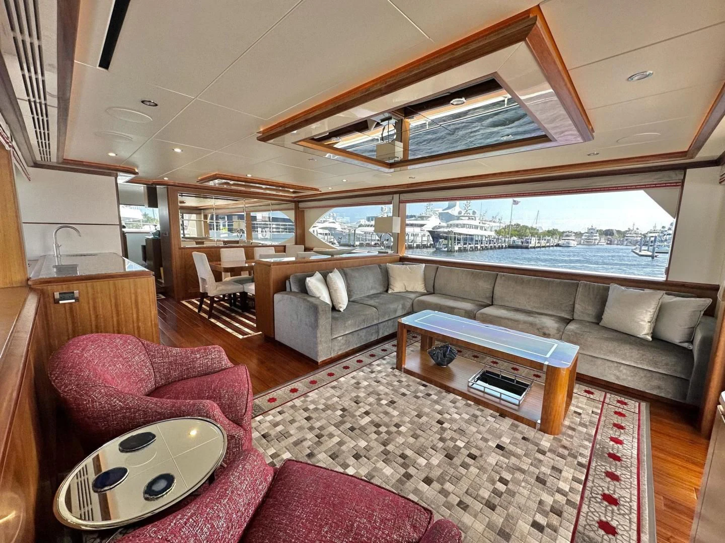 a living room with a large window aboard CRUMDALE Yacht for Sale