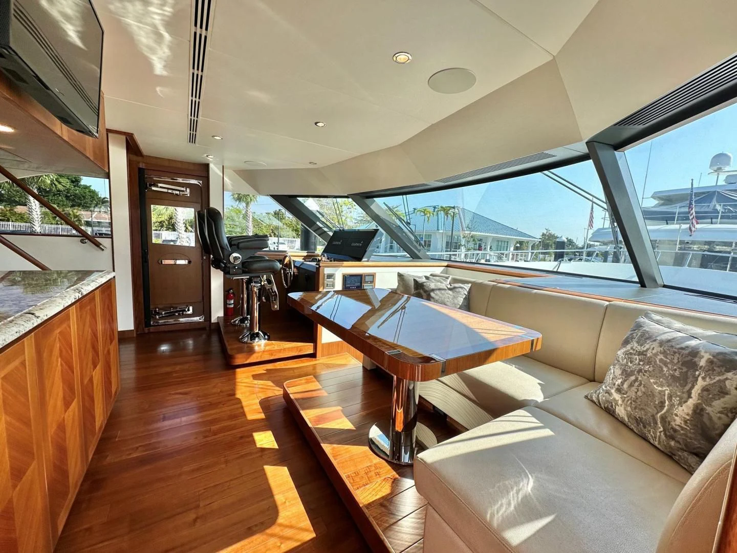 a living room with a large glass window aboard CRUMDALE Yacht for Sale
