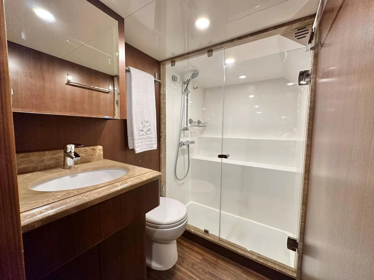 a bathroom with a shower and toilet aboard CRUMDALE Yacht for Sale