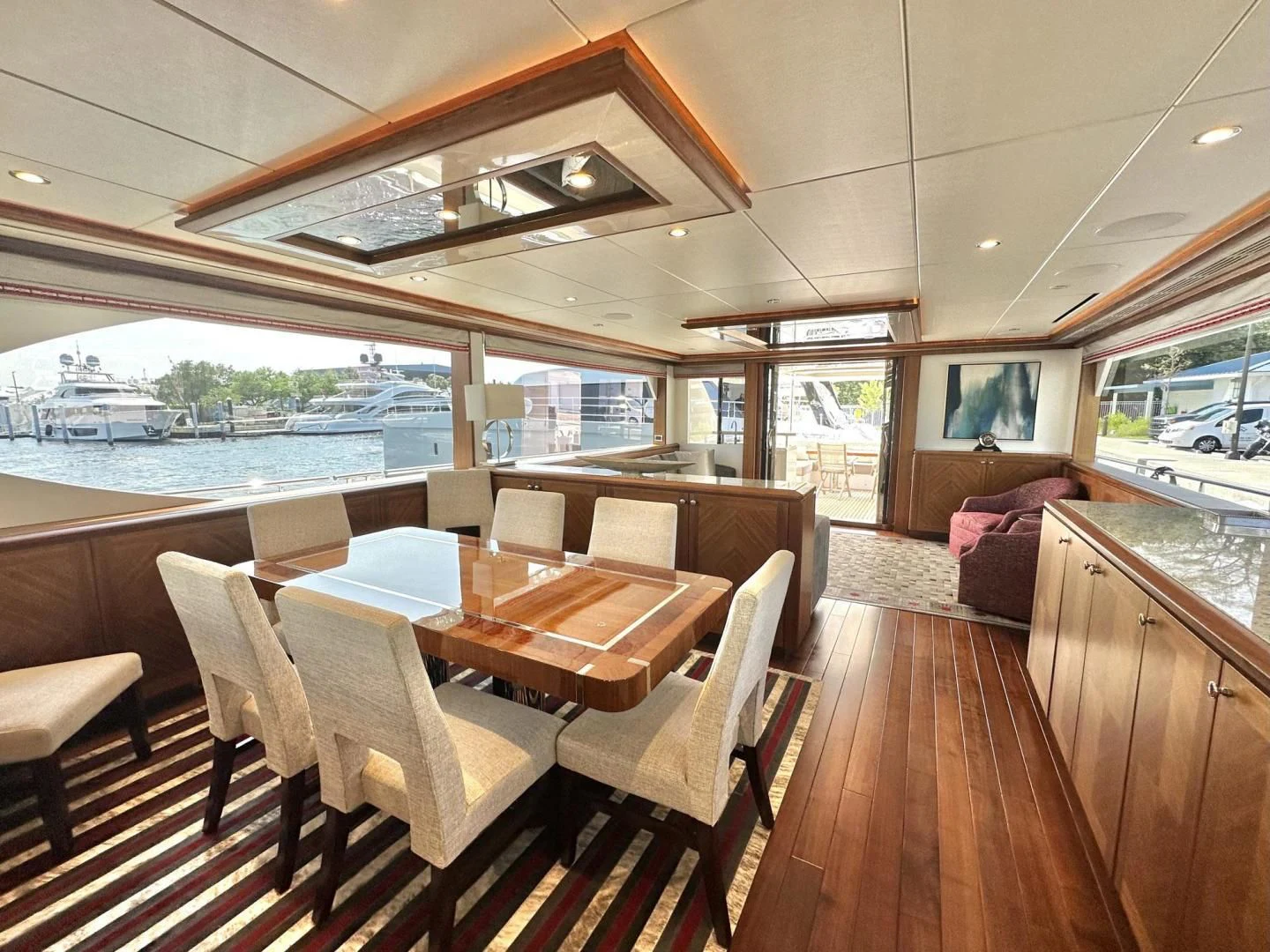 a room with a table and chairs aboard CRUMDALE Yacht for Sale