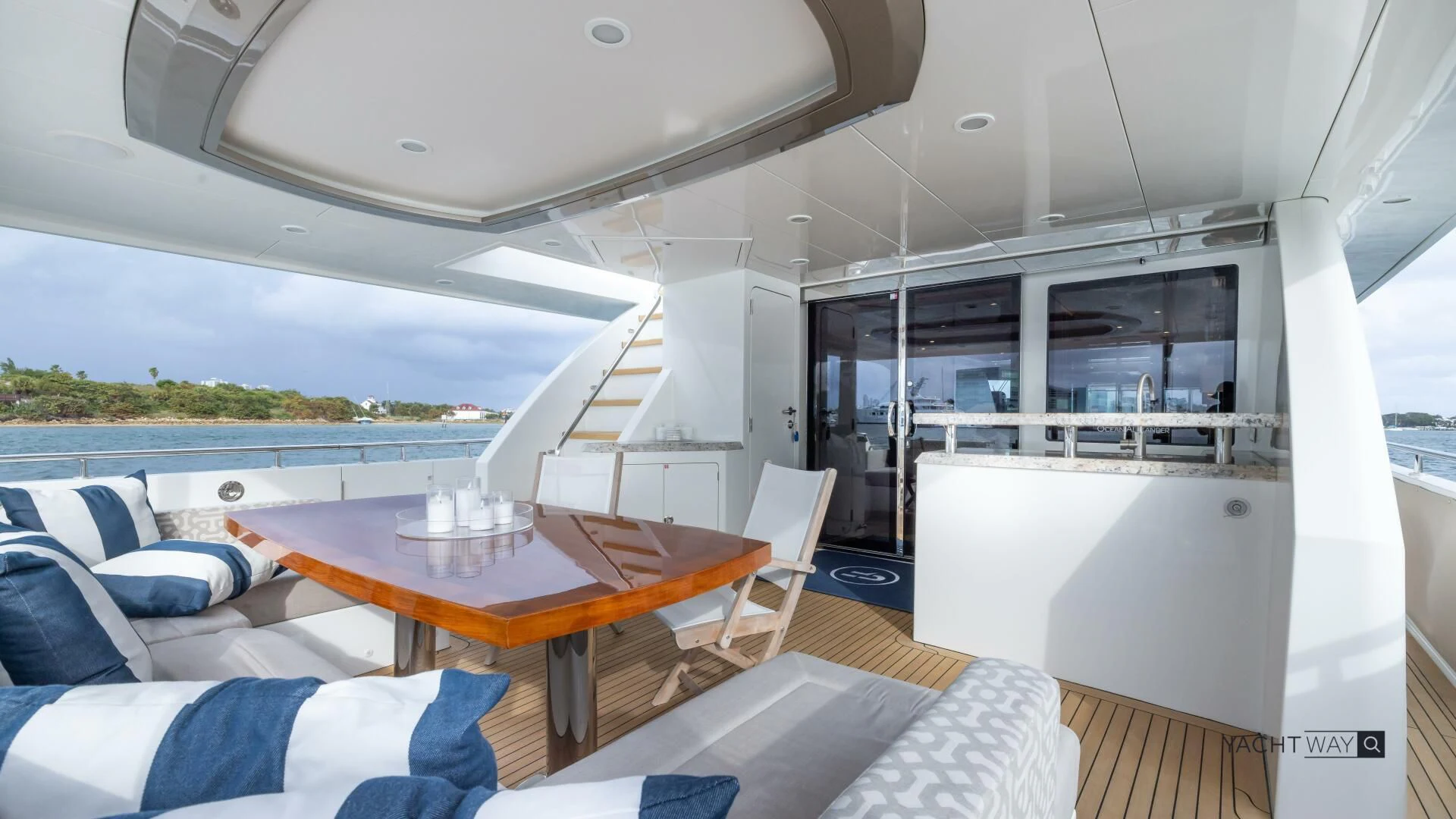 a boat with a table and chairs aboard CRUMDALE Yacht for Sale