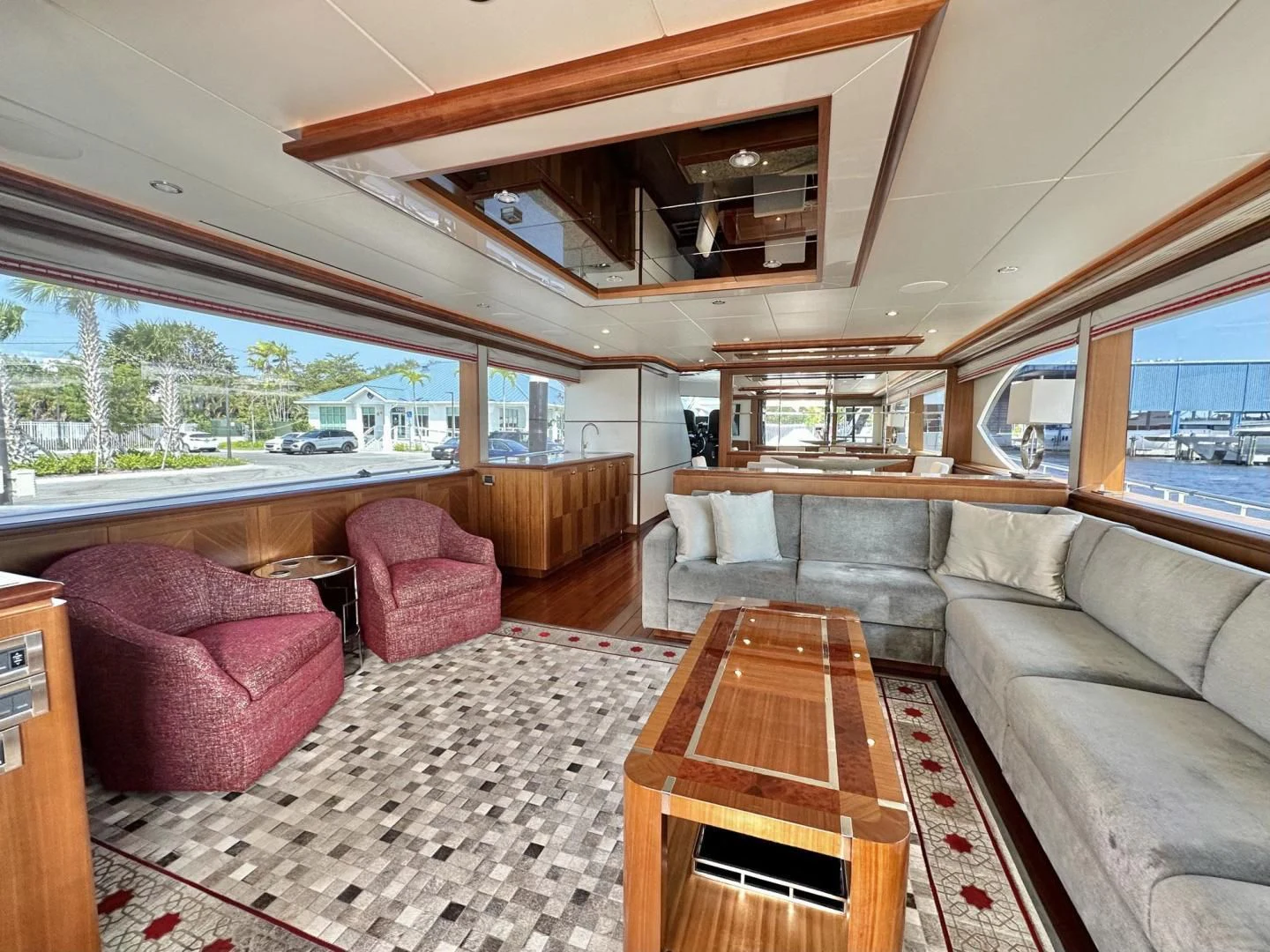a living room with a large window aboard CRUMDALE Yacht for Sale
