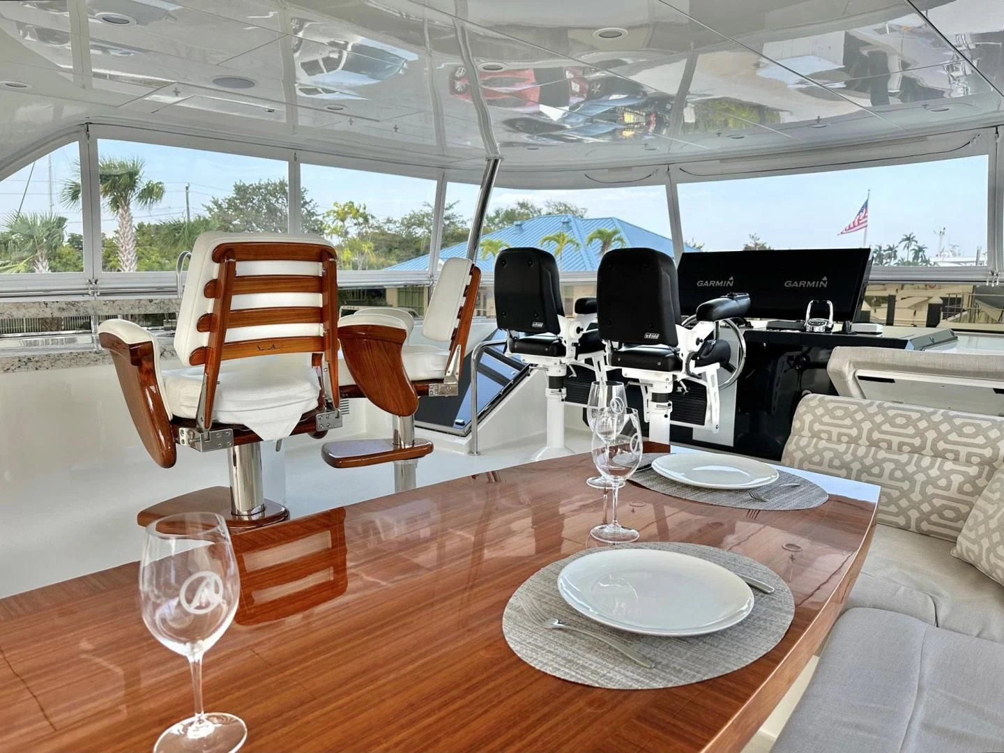 a table with wine glasses on it aboard CRUMDALE Yacht for Sale