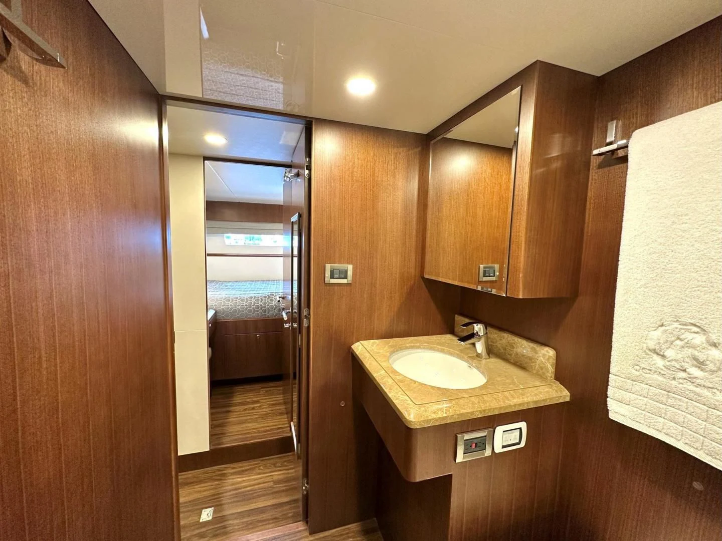 a bathroom with a sink and a mirror aboard CRUMDALE Yacht for Sale